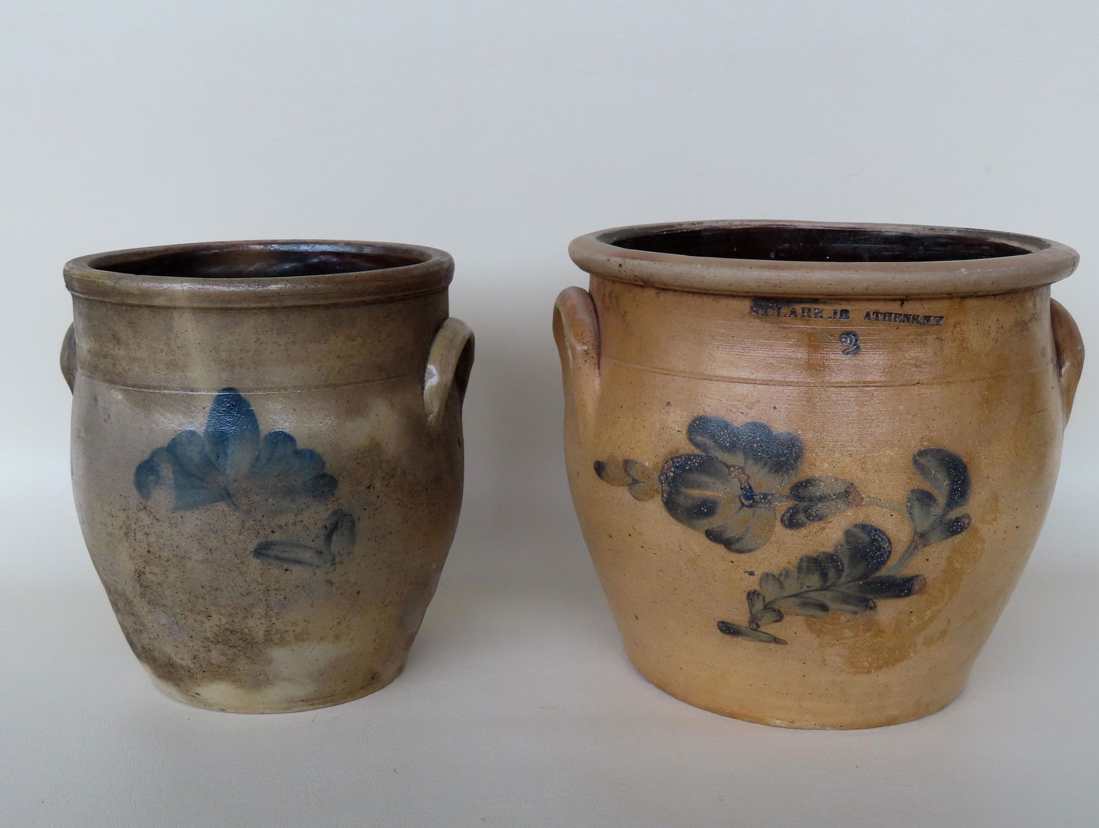 Two stoneware crocks, both slightly ovoid. The first, 1 gallon and decorated with a cobalt blue (1 of 6)