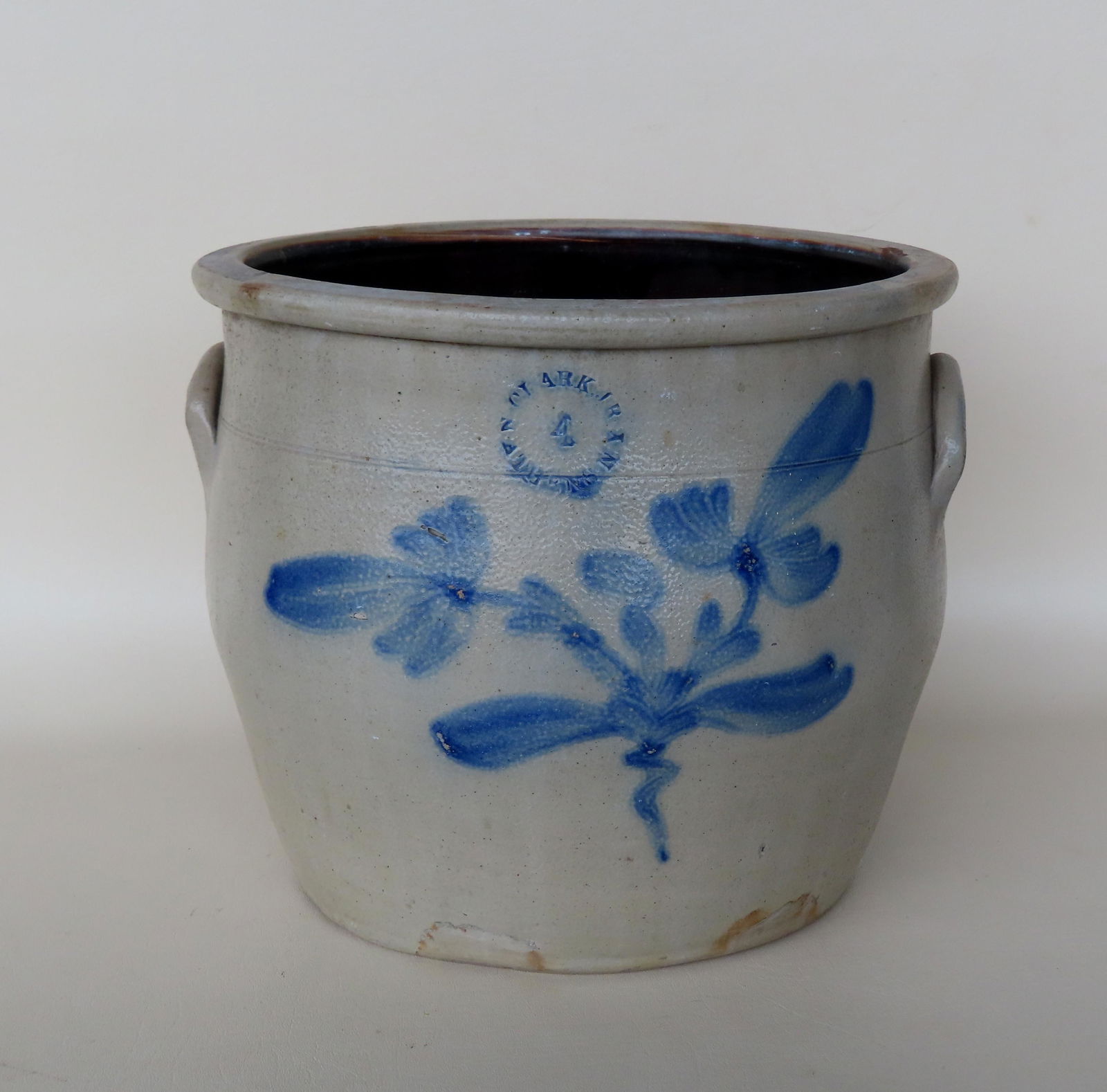 A stoneware crock, 4 gallon, decorated with a large cobalt blue double flower, with the impressed (1 of 5)