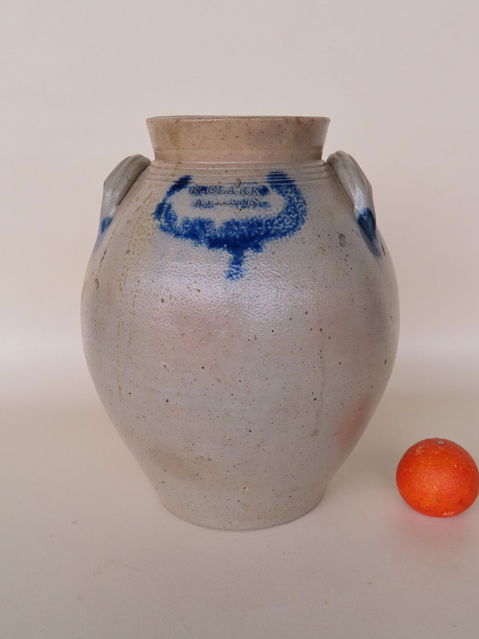 A stoneware ovoid jug, 3 gallon, impressed with maker's mark within cobalt blue wreath "N. CLARK (1 of 7)