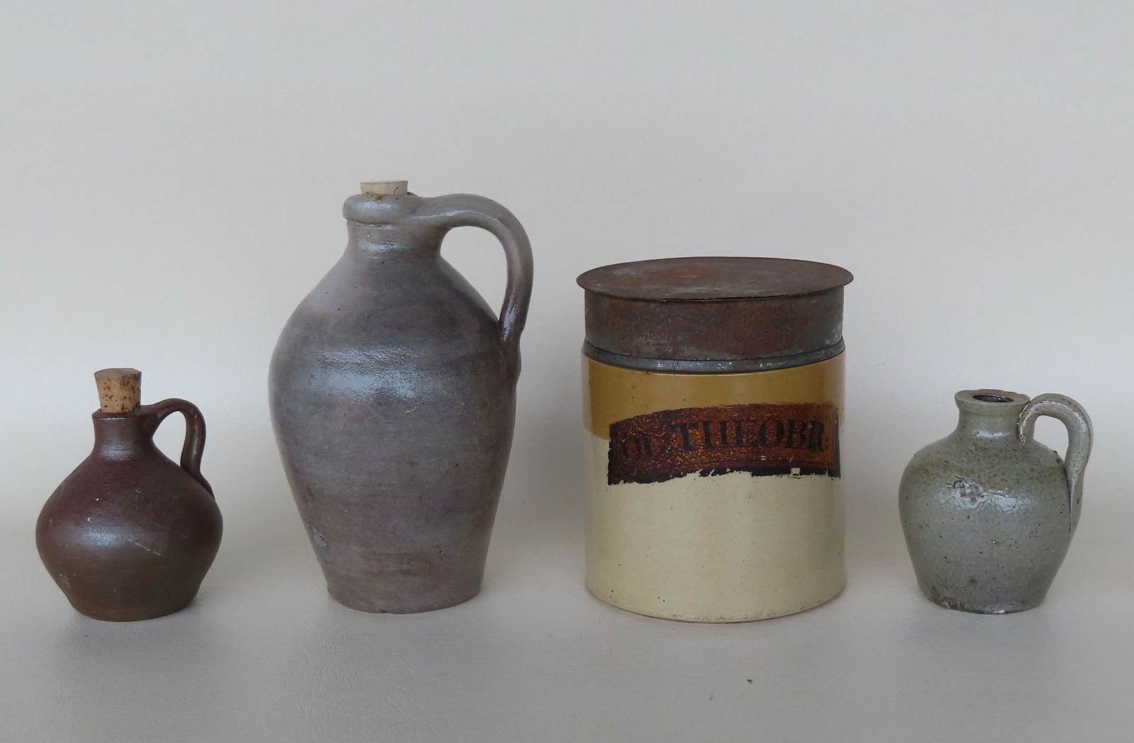 A grouping of 4 small pieces of stoneware ranging in size from 3 1/2"H (jug) to 6 1/2"H (ovoid jug). (1 of 13)