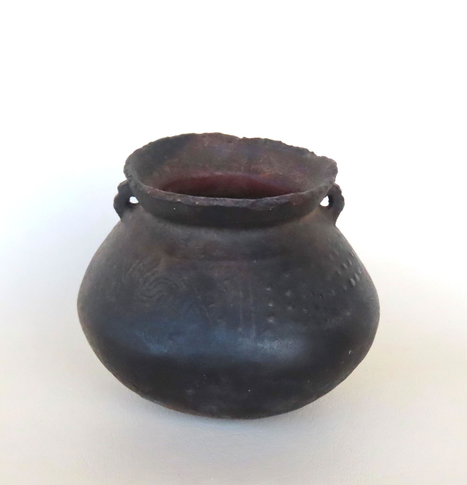 An ancient Native American "Mound Builder" pot with worn design under the flared rim and having ears (1 of 8)