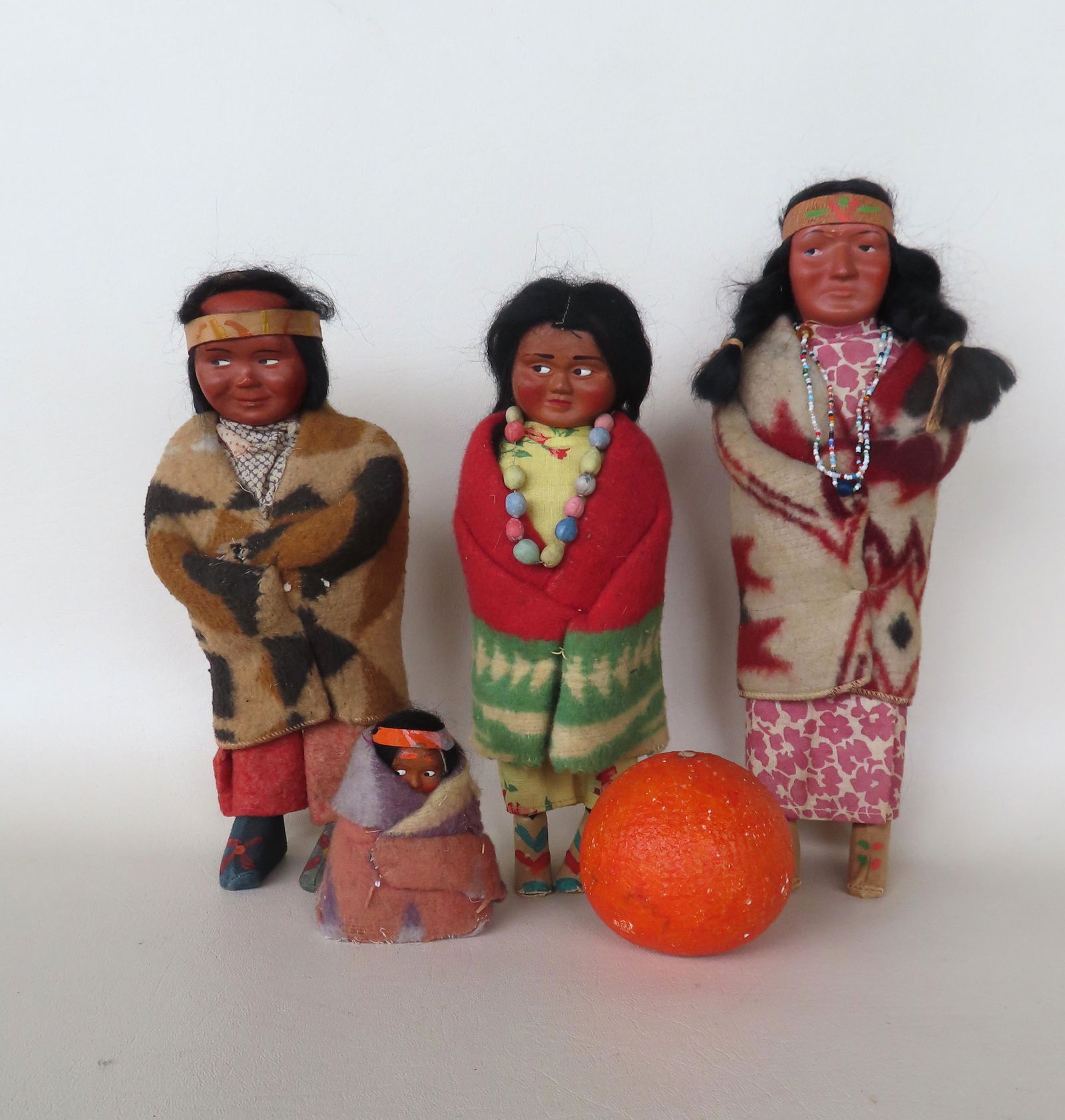 Grouping of 4 Skookum Indian dolls including papoose. One with sticker on base of foot, the others (1 of 9)