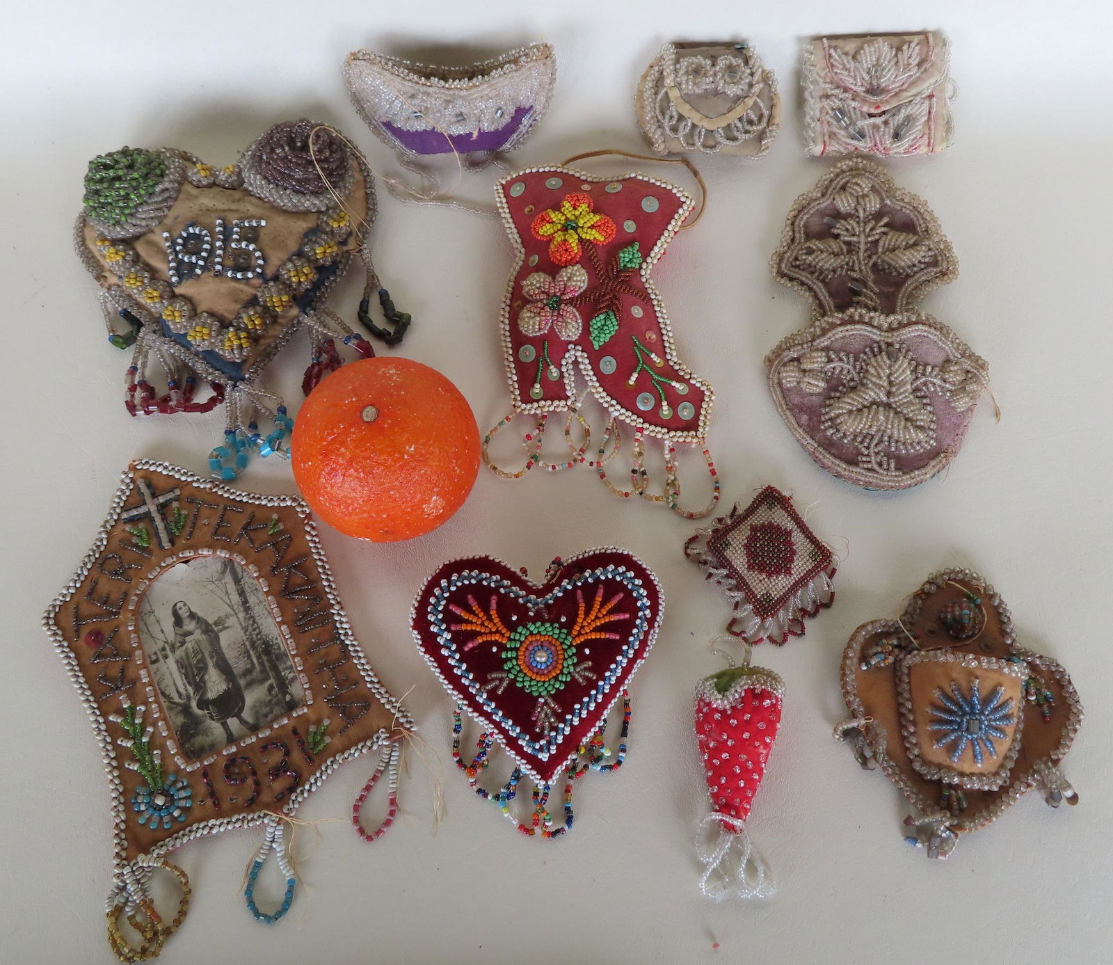 Grouping of 11 beaded Native American whimsies including a heart shaped pin cushion, canoe shaped (1 of 10)