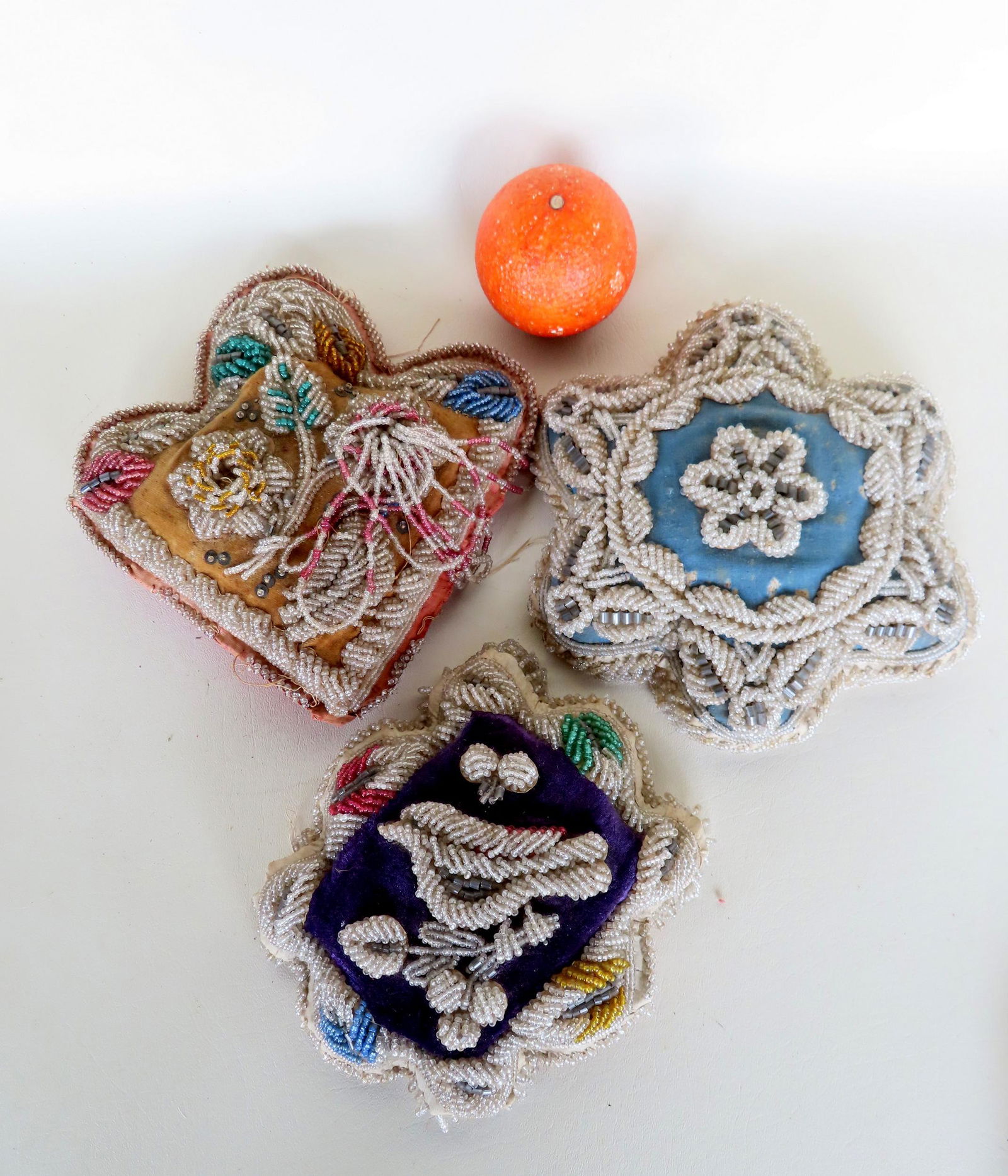 Three Native American beaded whimsies including: A large arrow-head shaped whimsy decorated with (1 of 7)