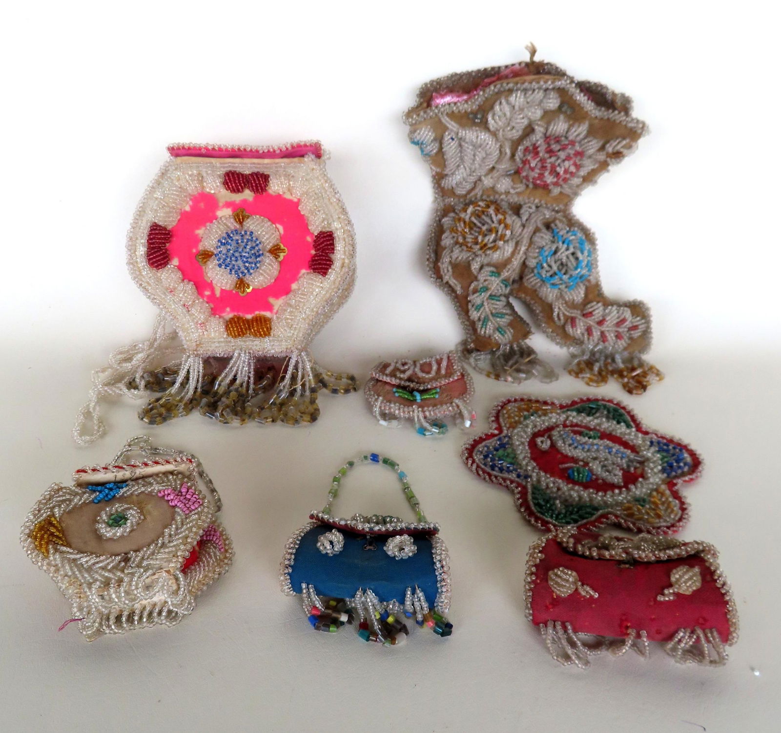 A grouping of 7 Native American beaded whimsies including: The largest, a purse dated on lid 1906, (1 of 17)