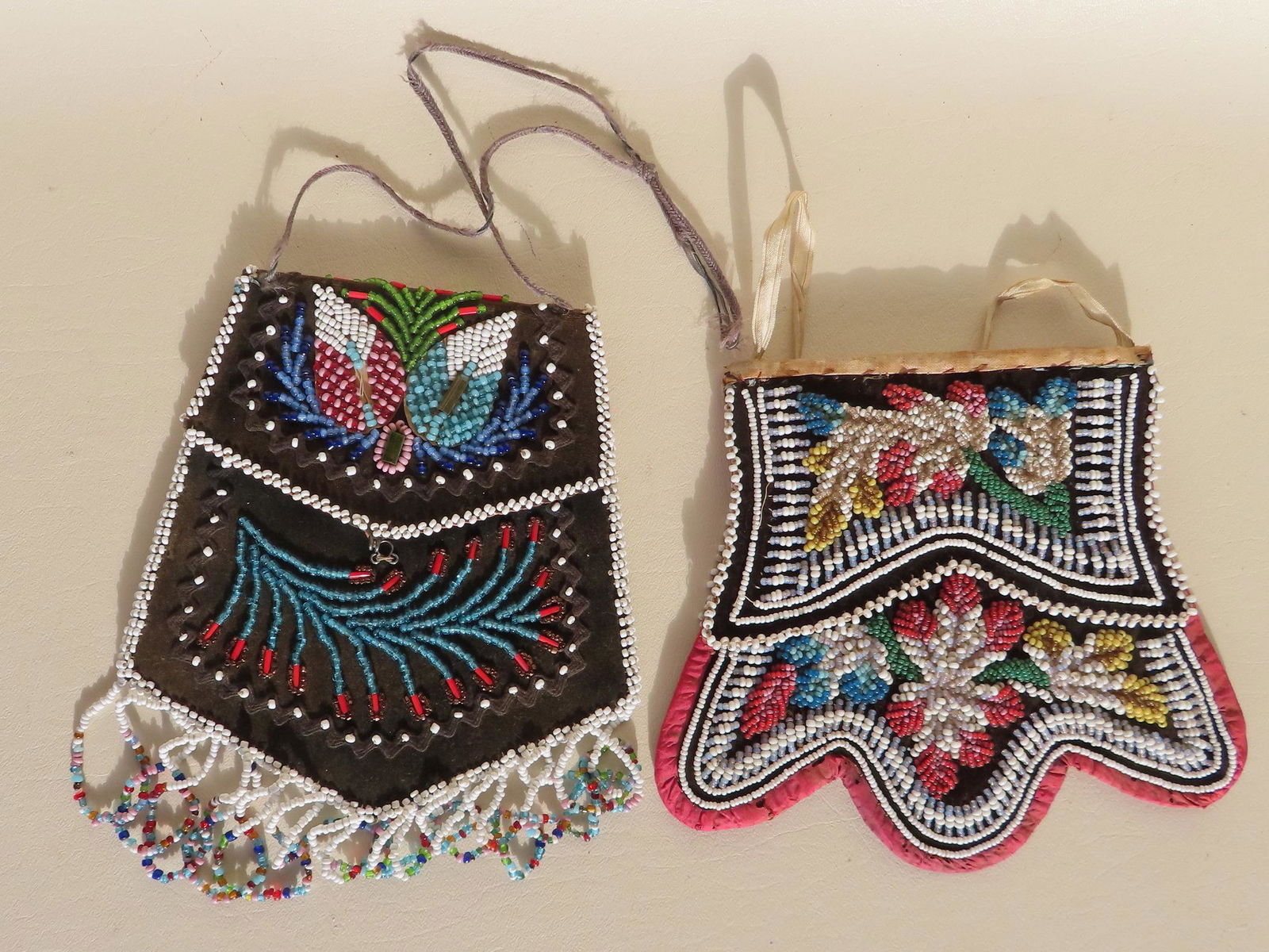 Two Native American beadwork purses with oilcloth backing. The first, colorful beads and flowers on (1 of 6)