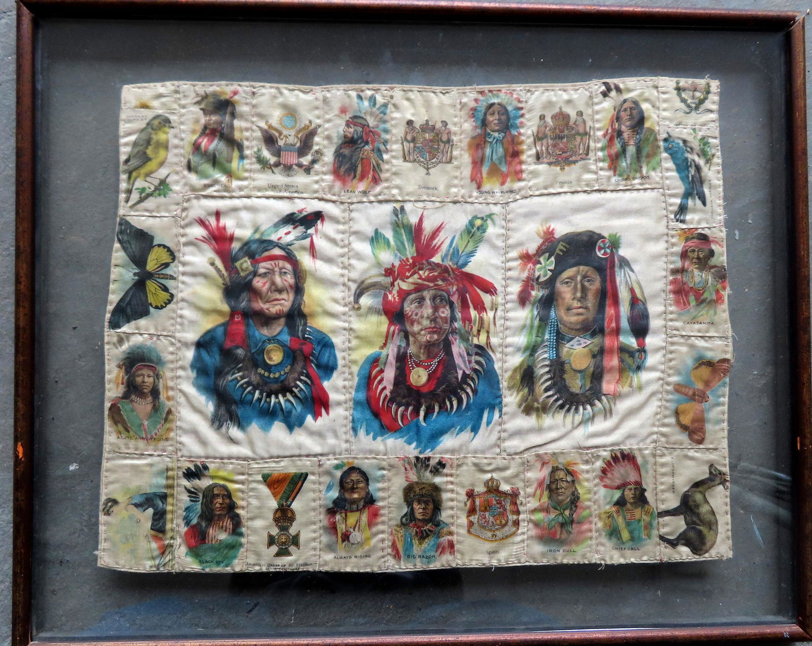 A small hand sewn doll's quilt, consisting of a grouping of 22 lithographed silk tobacco premiums, (1 of 4)