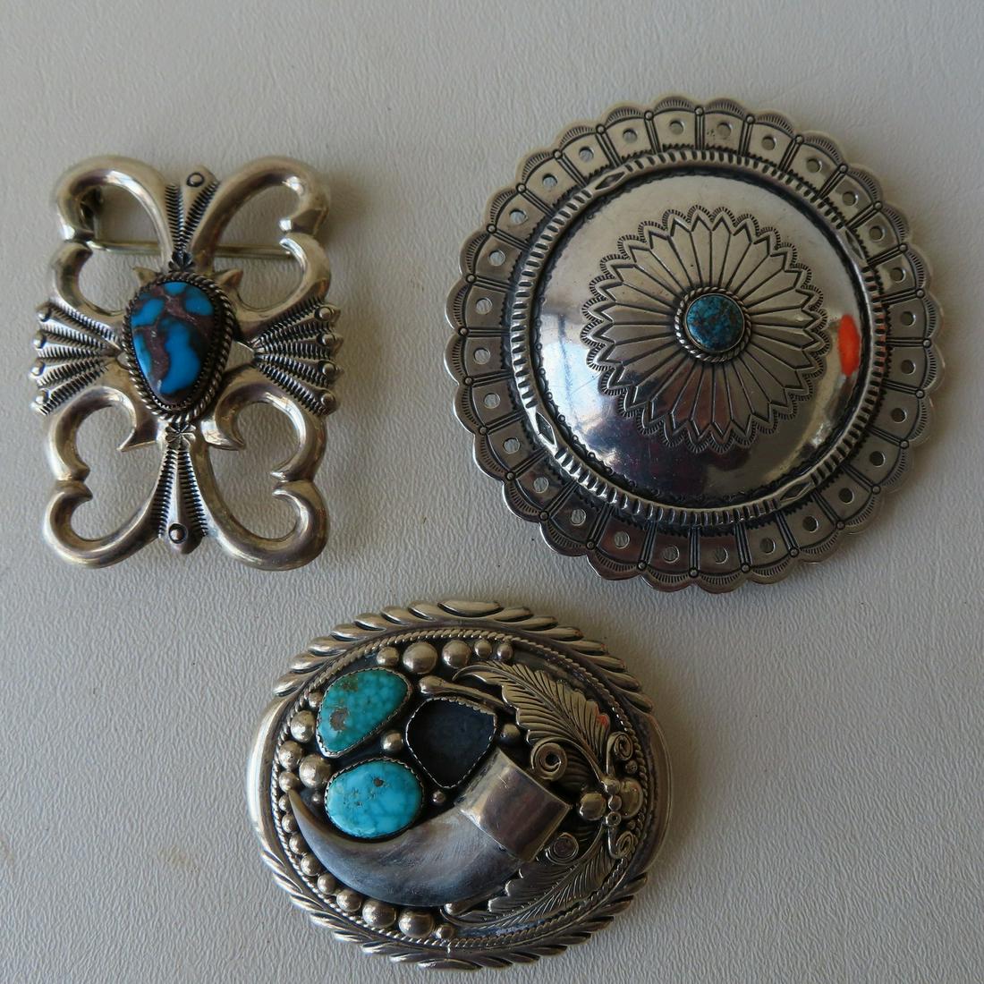 Three Native American made silver belt buckles, 2 marked sterling and 1 unmarked but believed to be (1 of 4)