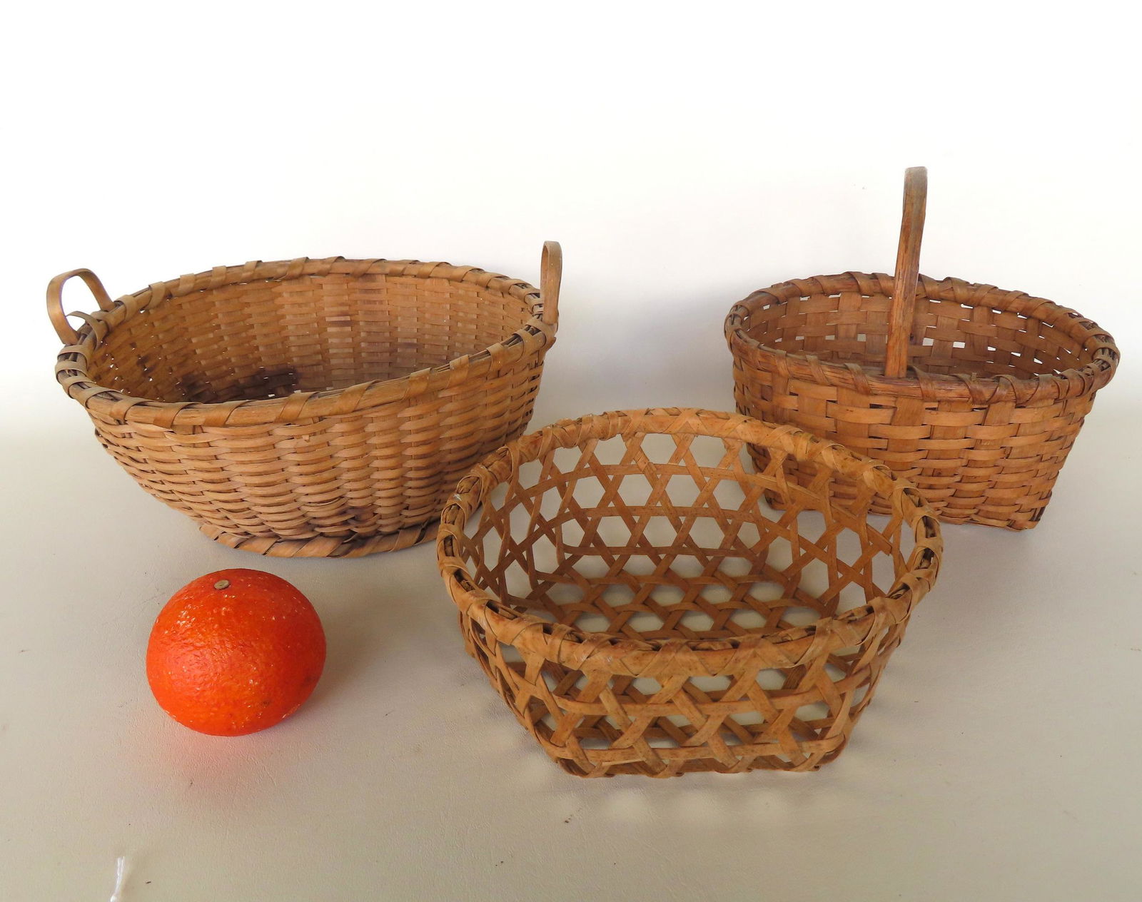 Grouping of 3 splint baskets including: Small basket with single loop handle and long tails, good (1 of 12)