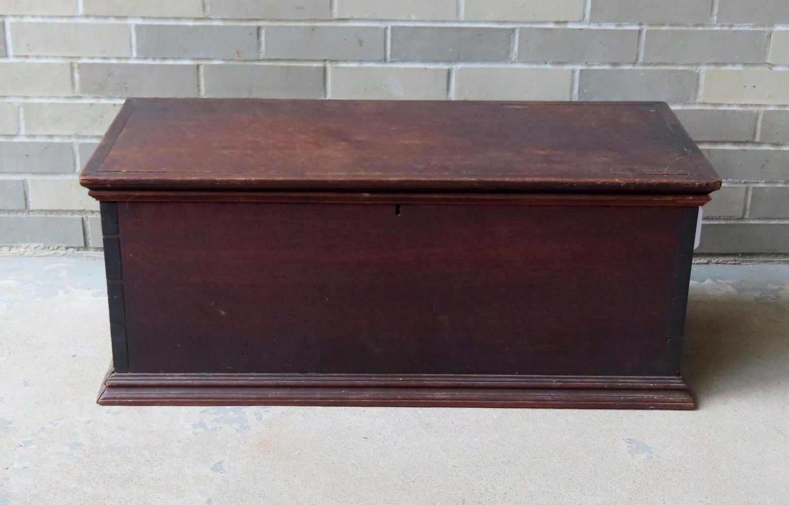 A small late 19th century black walnut storage box with stepped molding on base and dovetailed (1 of 7)