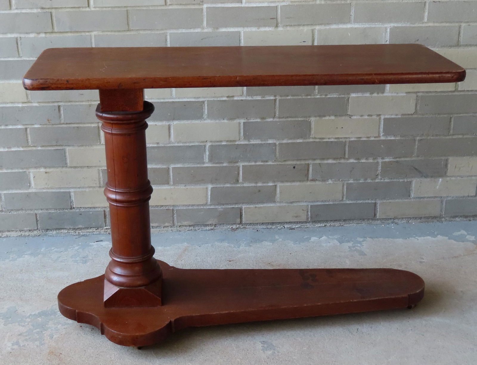 An Empire period floor standing adjustable over bed serving table in walnut, having a turned column (1 of 5)