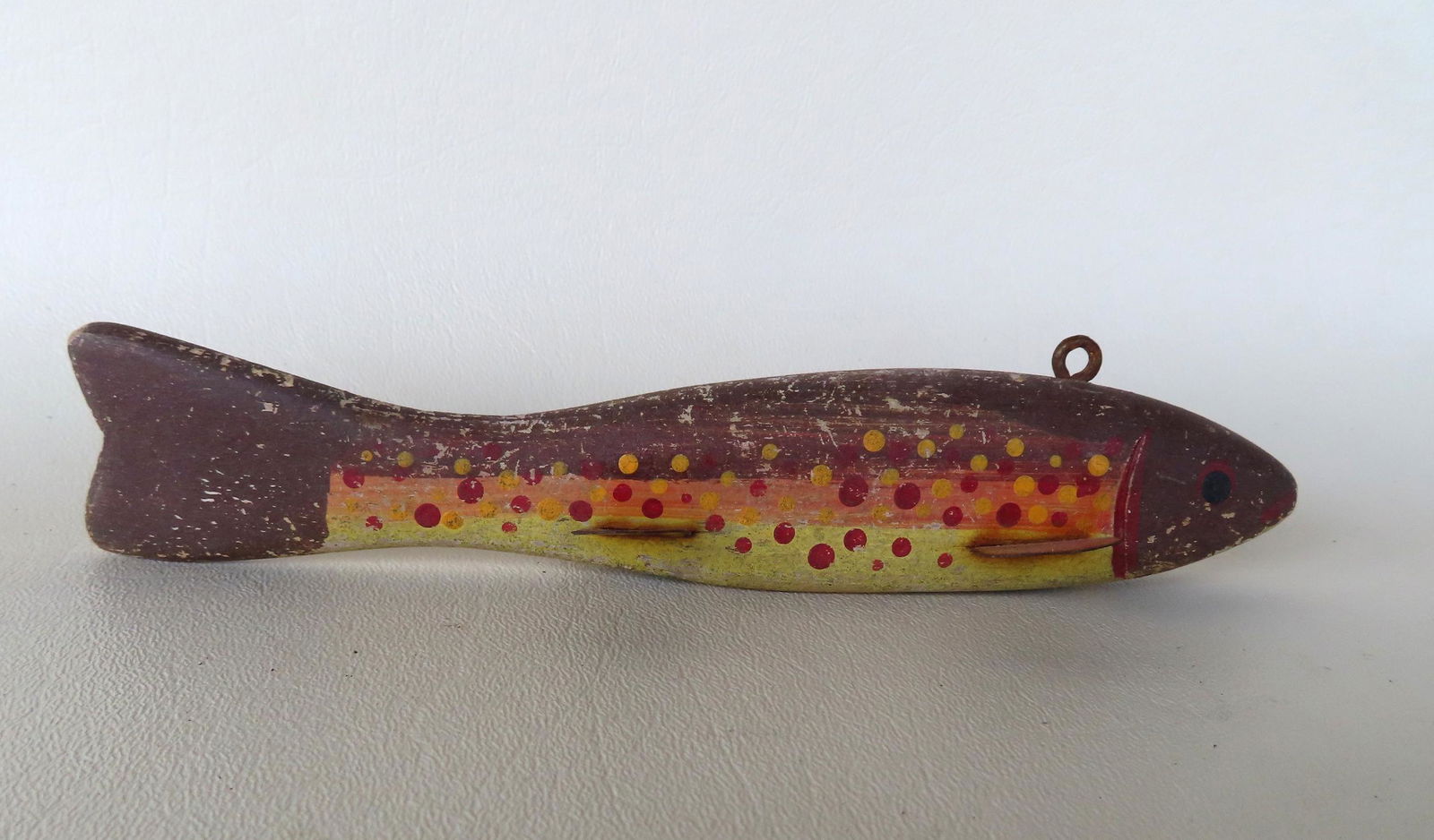 A good hand carved ice fishing decoy in original paint, likely to simulate a brook trout, having (1 of 6)