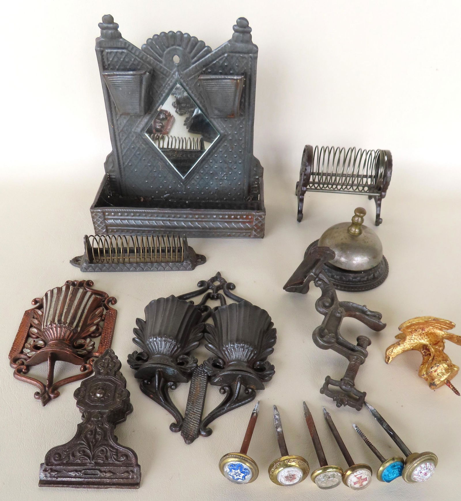 Grouping of country primitives, all in metal, 19th and 20th century, including: Two wall mounted (1 of 7)