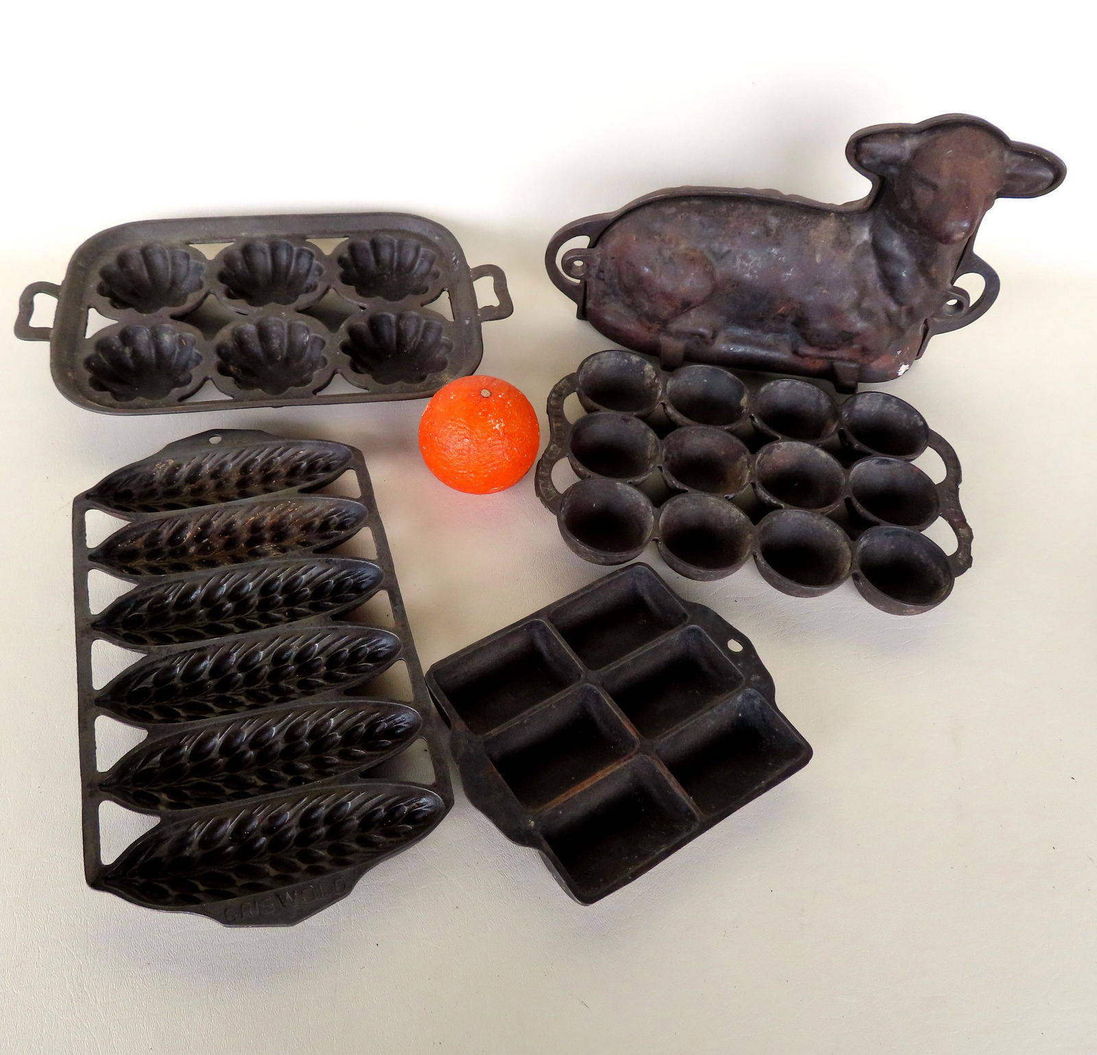 Grouping of 5 cast iron biscuit and cake molds including: Easter lamb cake mold measuring 12 1/2"L x (1 of 8)