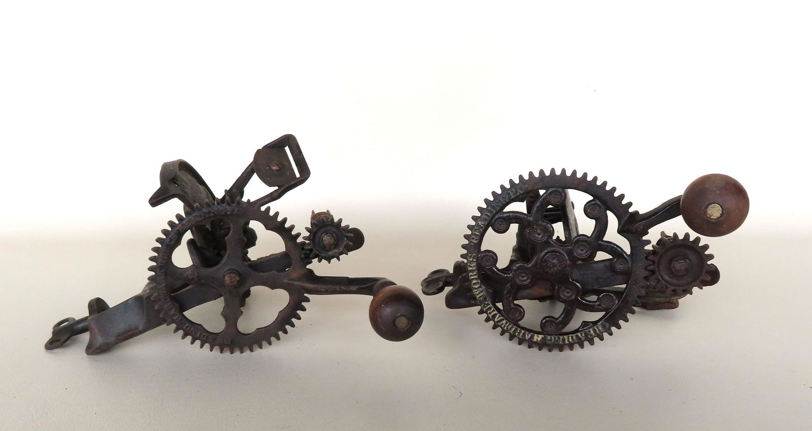 Two cast iron apple peelers, 19th century in working order. Both signed "READING HARDWARE WORKS / (1 of 11)