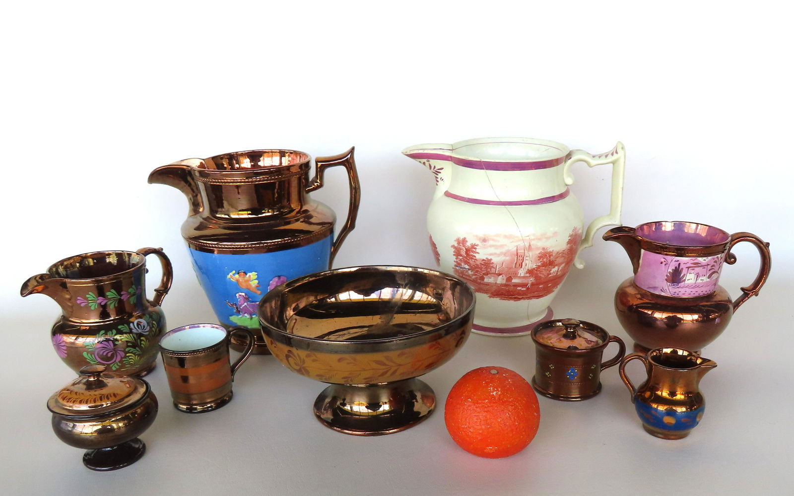 Grouping of 8 pieces of lusterware, all with chips and hairlines. The largest, a creamware pitcher (1 of 19)