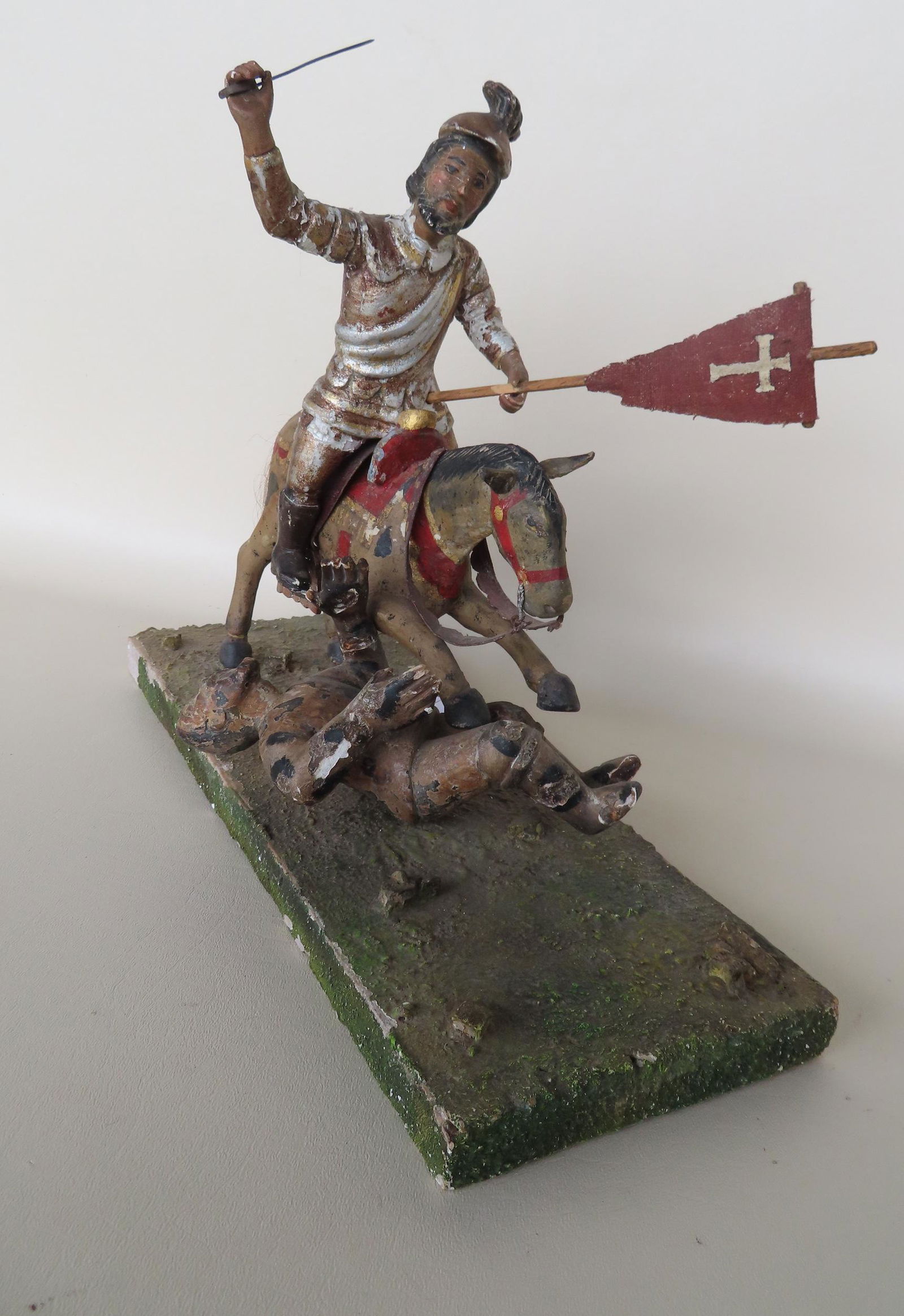 A primitive diorama depicting a crusade soldier on horseback holding sword and flag and horse (1 of 17)