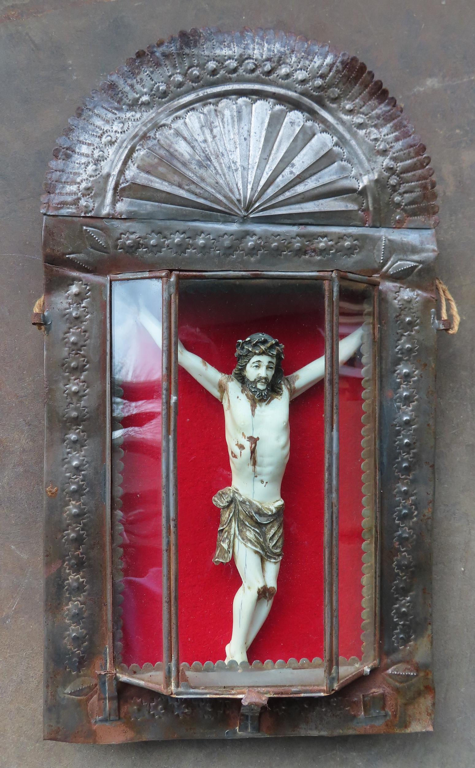 A framed diorama depicting the Crucifixion of Jesus - the sculpture within shadowbox tin frame,: A framed diorama depicting the Crucifixion of Jesus - the sculpture within shadowbox tin frame, appears to be constructed of bone, late 19th to early 20th century. The tin frame is all hand made, and 