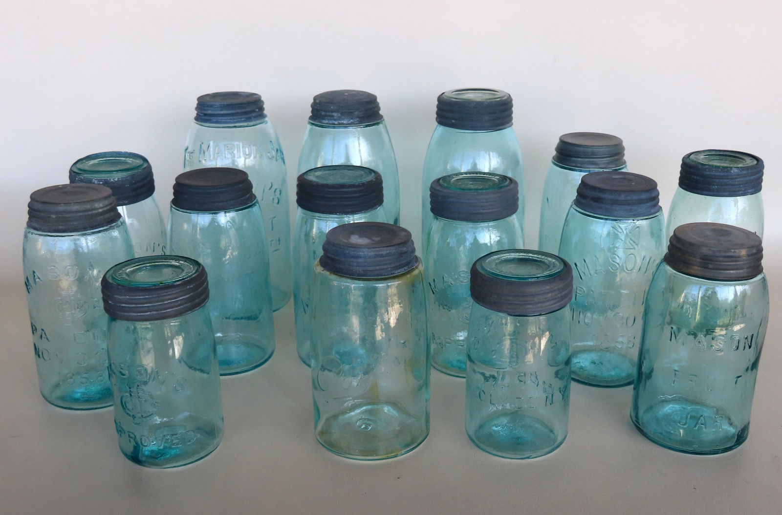A grouping of 15 Mason fruit and canning jars including: One "Mason's Improved / Nov. 26 '67"; two (1 of 13)