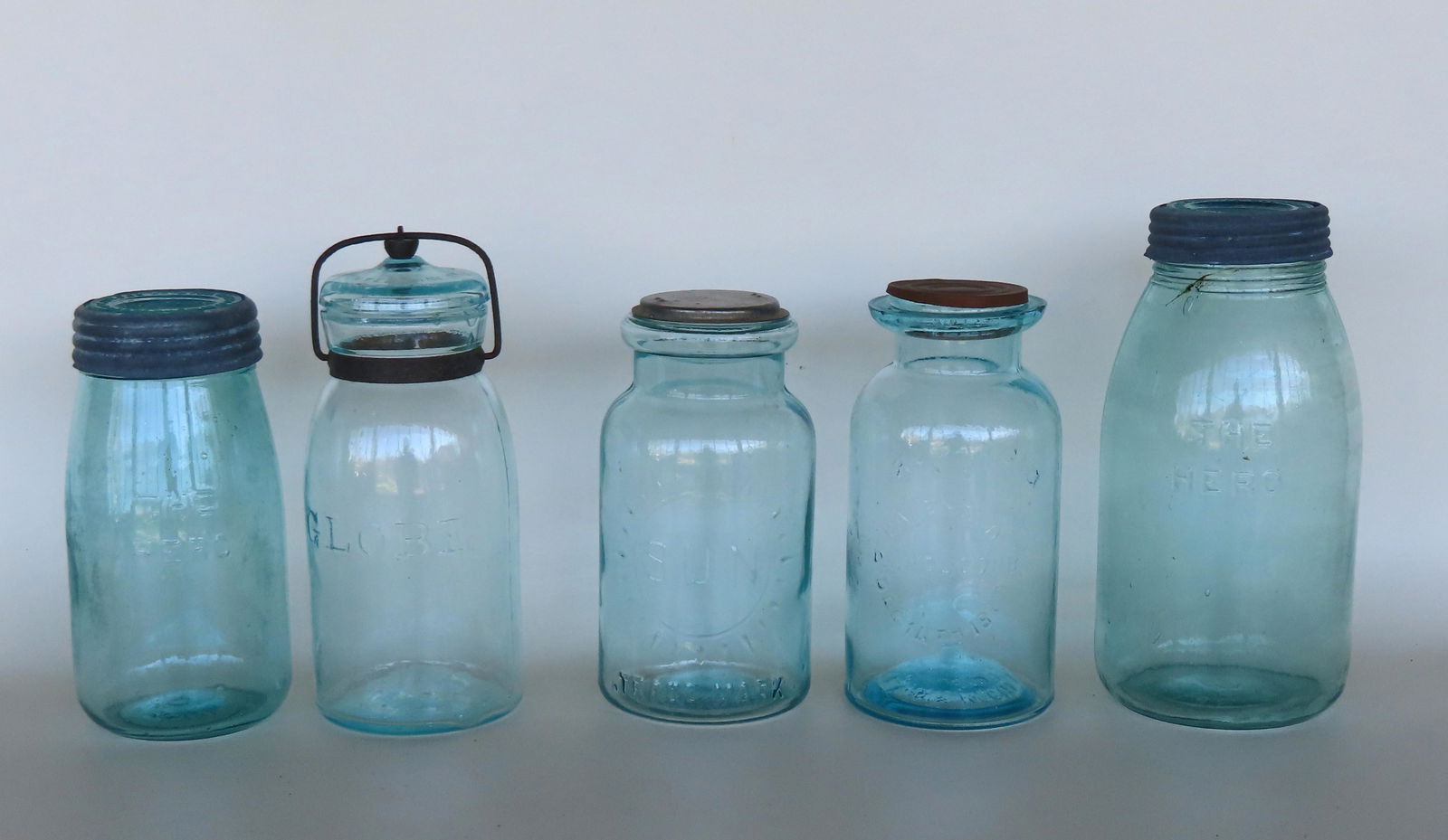 A grouping of 5 fruit jars including: "The Hero / Patd Nov 26 1867 / 18" - 7 1/4"H; "The Hero / Patd (1 of 7)