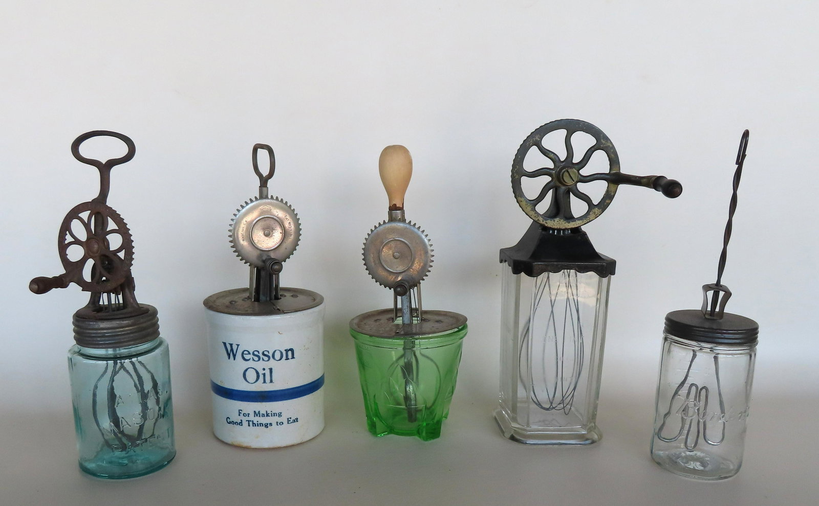 A grouping of 5 vintage kitchen egg/cream mixers with original glass jars including: "Borden's", (1 of 12)