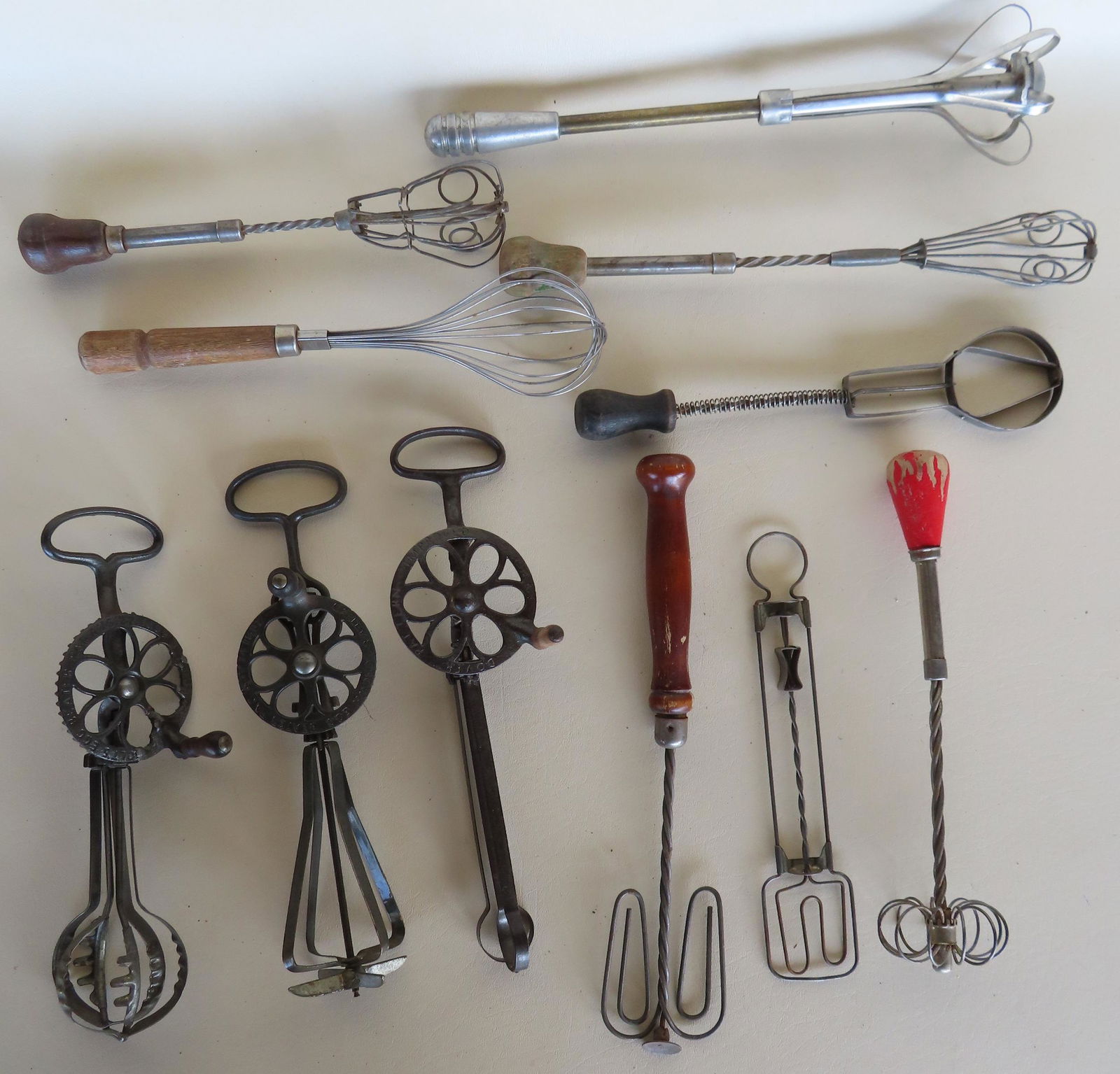 A grouping of 11 hand held mixing utensils/beaters including 1 wire whisk, 7 wire mechanical mixers (1 of 4)