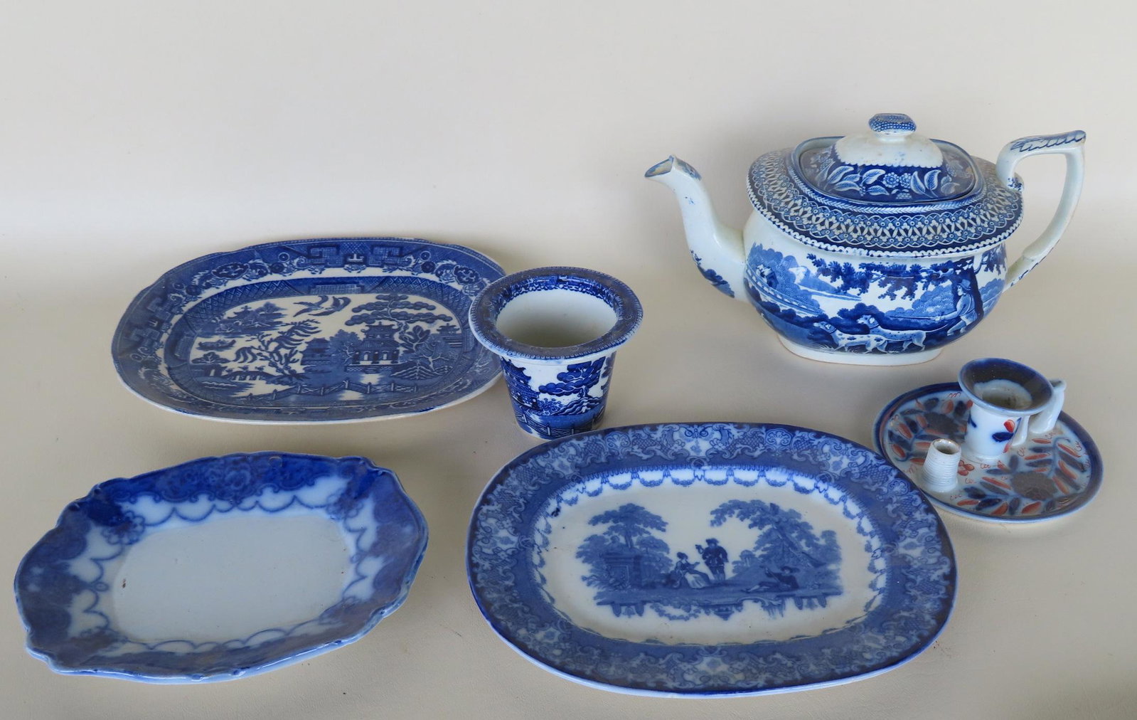 Grouping of 6 early transferware china, most blue and white.: Grouping of 6 early transferware dinnerware including 3 small blue and white platters - the largest 9 1/2" x 7 3/4"; a Staffordshire teapot decorated with a hunter with long rifle and sporting dogs wi
