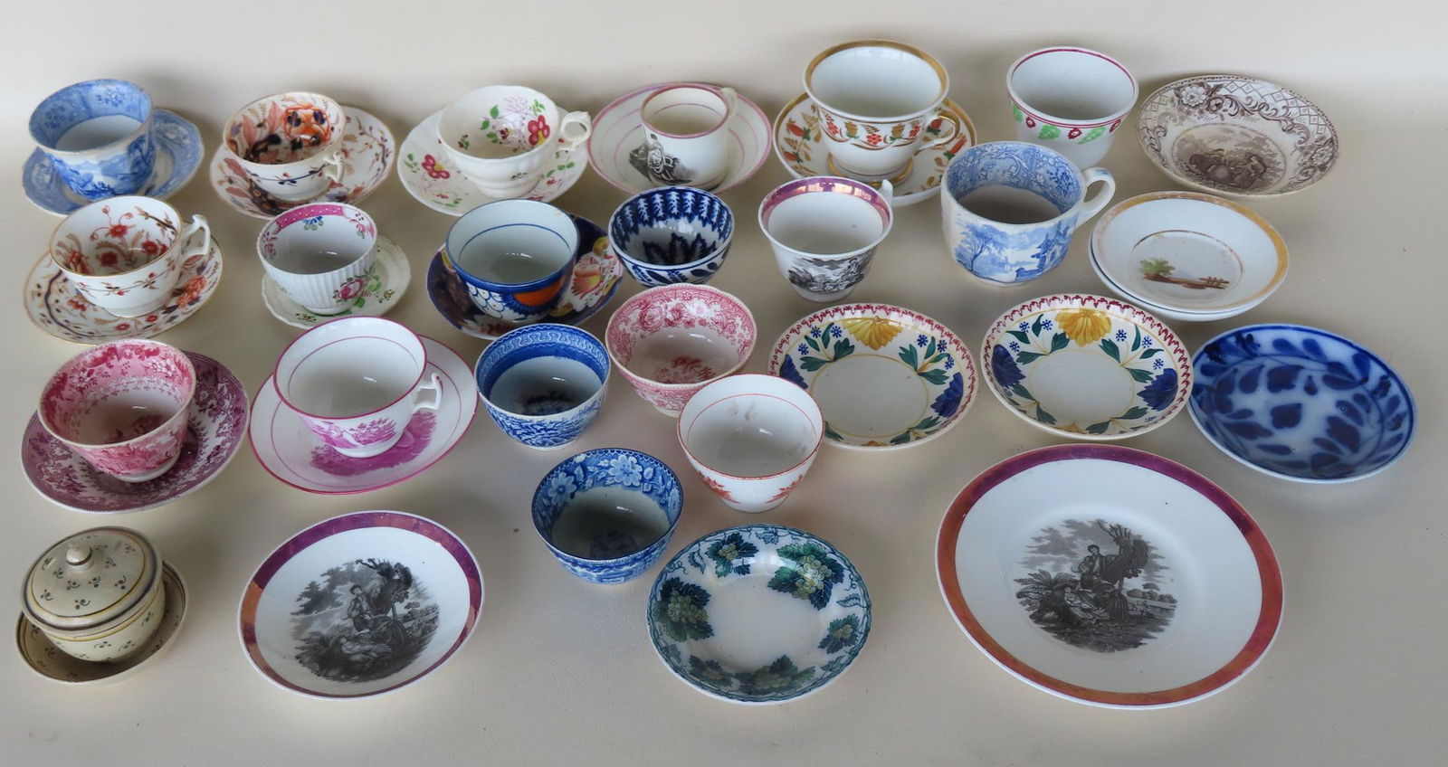 Large grouping of early tea cups and saucers, 19th century. (1 of 14)