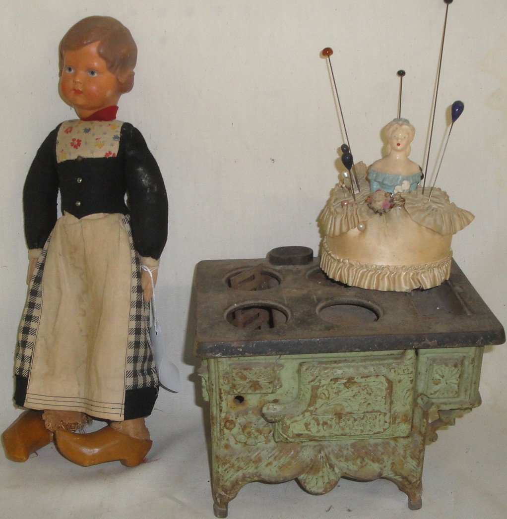 Lot of misc. toys including cast iron toy stove "Que: Lot of misc. toys including cast iron toy stove "Queen" missing hot plates, German doll, pin cushion doll with stick pins.