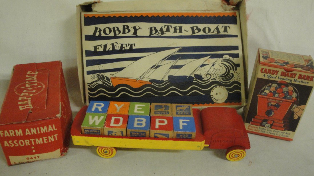 Lot of 4 toys: Candy mart vending machine in origin: Lot of 4 toys: Candy mart vending machine in original box, Happy Time Farm Animals in original box, Bobby Bath Boat fleet with 4 sailboats in original box, Halsom block set in truck.