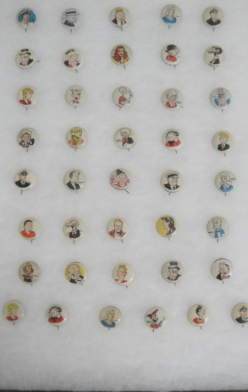 Grouping of 41 pinbacks of comic book characters in: Grouping of 41 pinbacks of comic book characters including Smokey Stover, Blondie, Skeezix, Kayo, Smilin Jack, Wimphy, Little Orphan Annie & Sandy, etc.