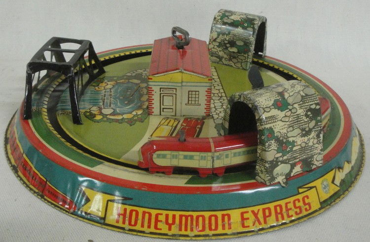 Windup lithograph tin train set by Marx entitled ": Windup lithograph tin train set by Marx entitled "Honeymoon Express"