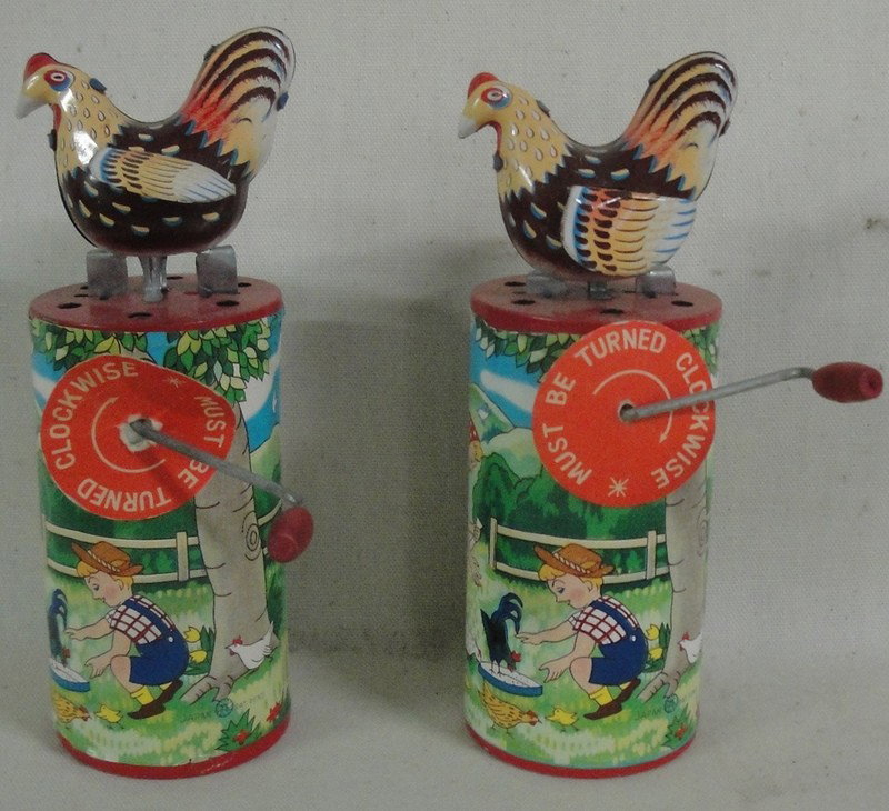 Two cackling windup animated hens - ca. 1950: Two cackling windup animated hens - ca. 1950