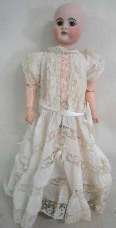 German doll marked 252 Dep No. 12 - fixed brown ey: German doll marked 252 Dep No. 12 - fixed brown eyes - pierced ears - jointed plaster over wood body - 21" high