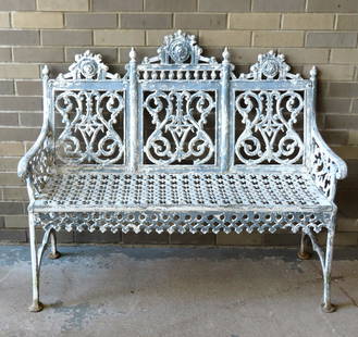 A classical cast iron garden bench attributed to John McLean, New York, late 19th century.  Measures: A classical cast iron garden bench attributed to John McLean, New York, late 19th century. Measures 45 1/2"W x 19 1/4"D x 38"H x 16 1/2" seat height. Bolts missing that tie front legs to apron and hav