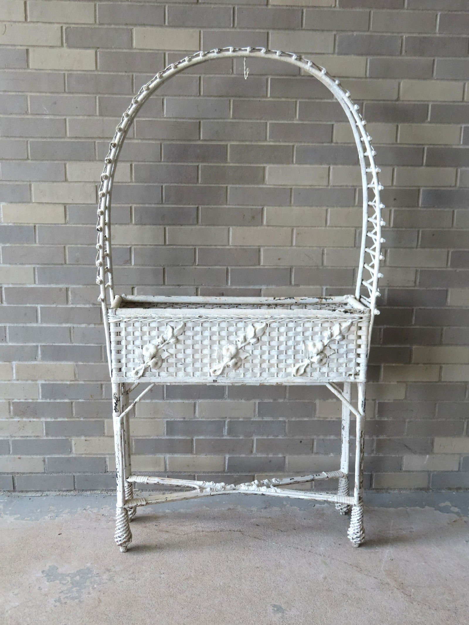 An unusual wicker planter with built in shaped rustic wood trellis over planter with applied flowers (1 of 6)