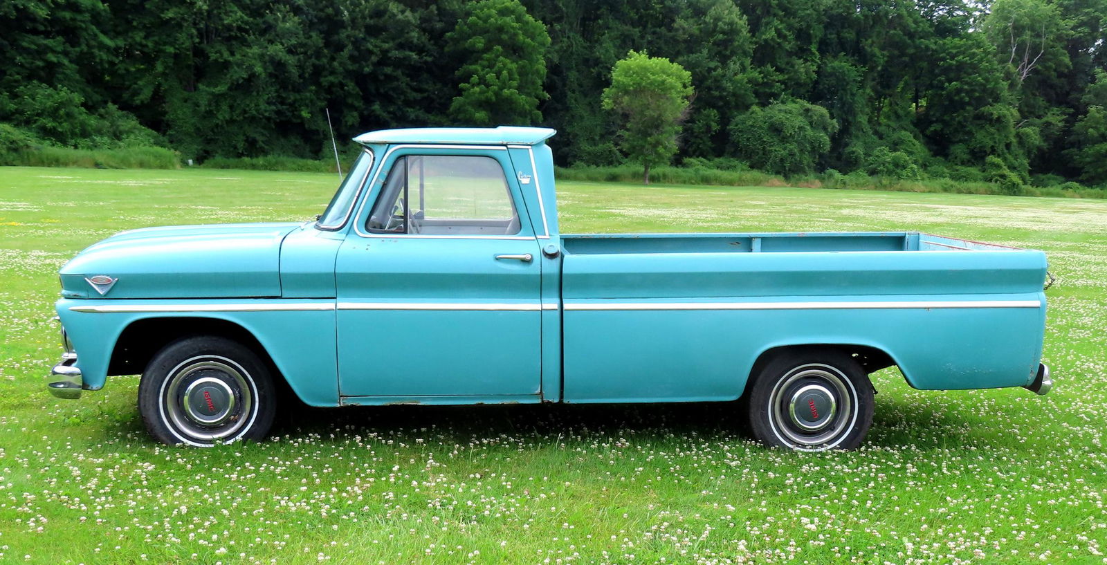 A GMC 1965 pickup truck, V-6 with 3 speed transmission. Slight rust under door edges, several dings, (1 of 19)