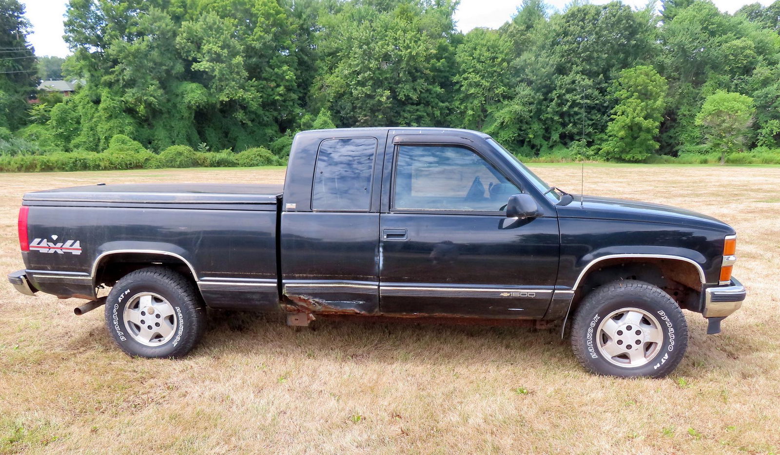 A 1995 Chevy Silverado pickup truck with 279, 405 miles - 4 wheel drive. Condition - some body rust (1 of 20)