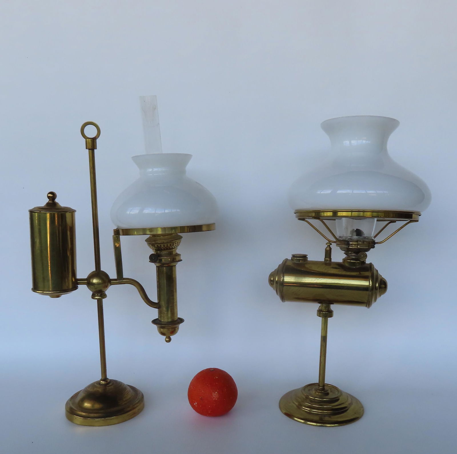 Two adjustable brass student lamps, 19th century, with milk glass shades. The first, with an unusual (1 of 7)