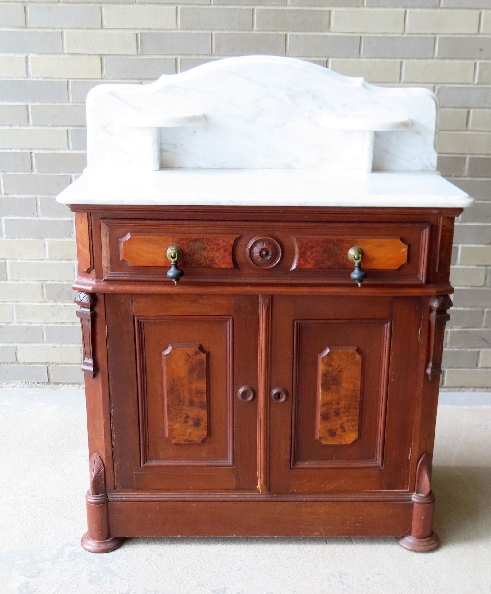 A Victorian black walnut marble top washstand with marble backsplash, having 1 long drawer over 2 (1 of 7)