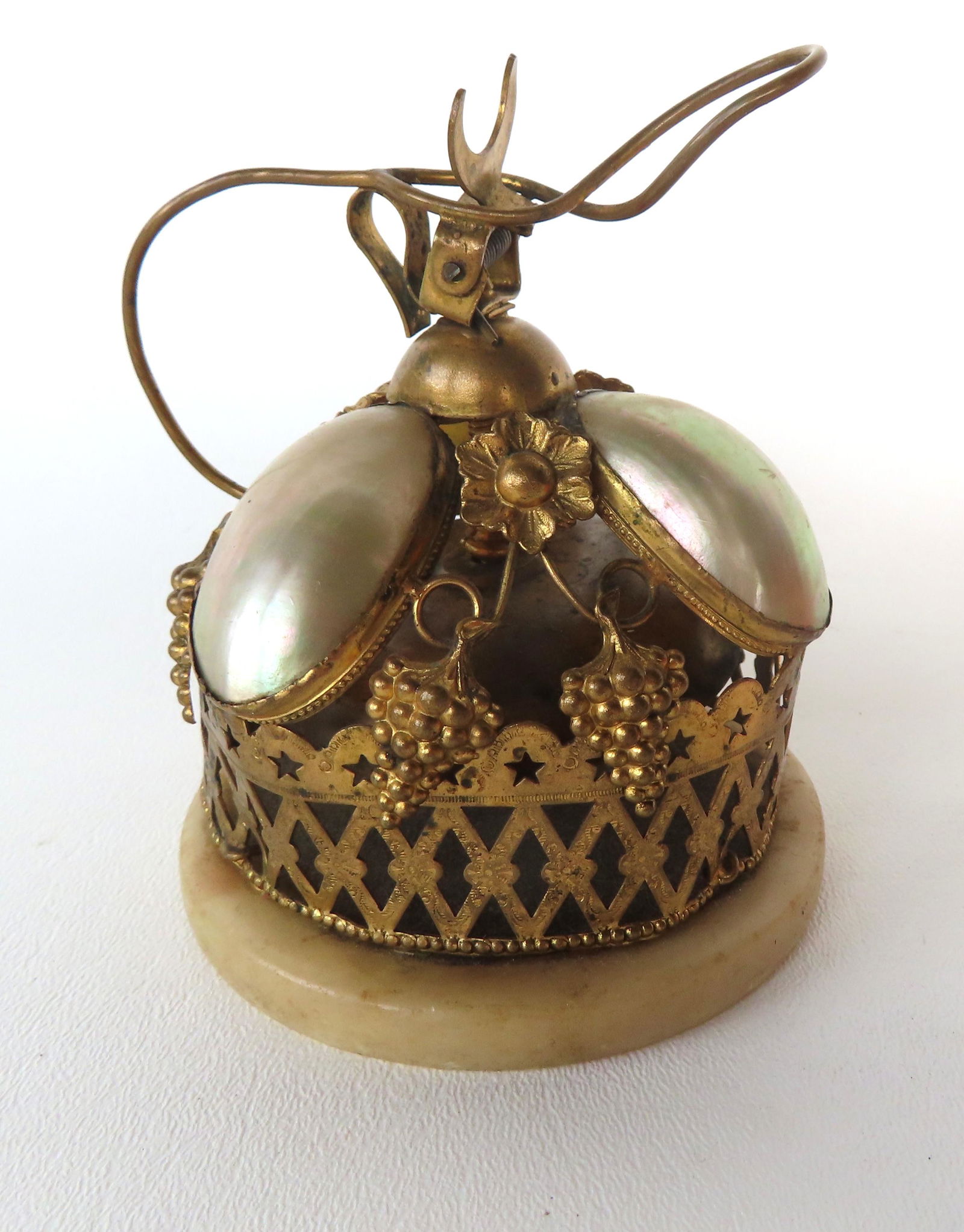 An unusual maid's bell decorated with a fancy gilt metal fence attached to alabaster base below (1 of 6)