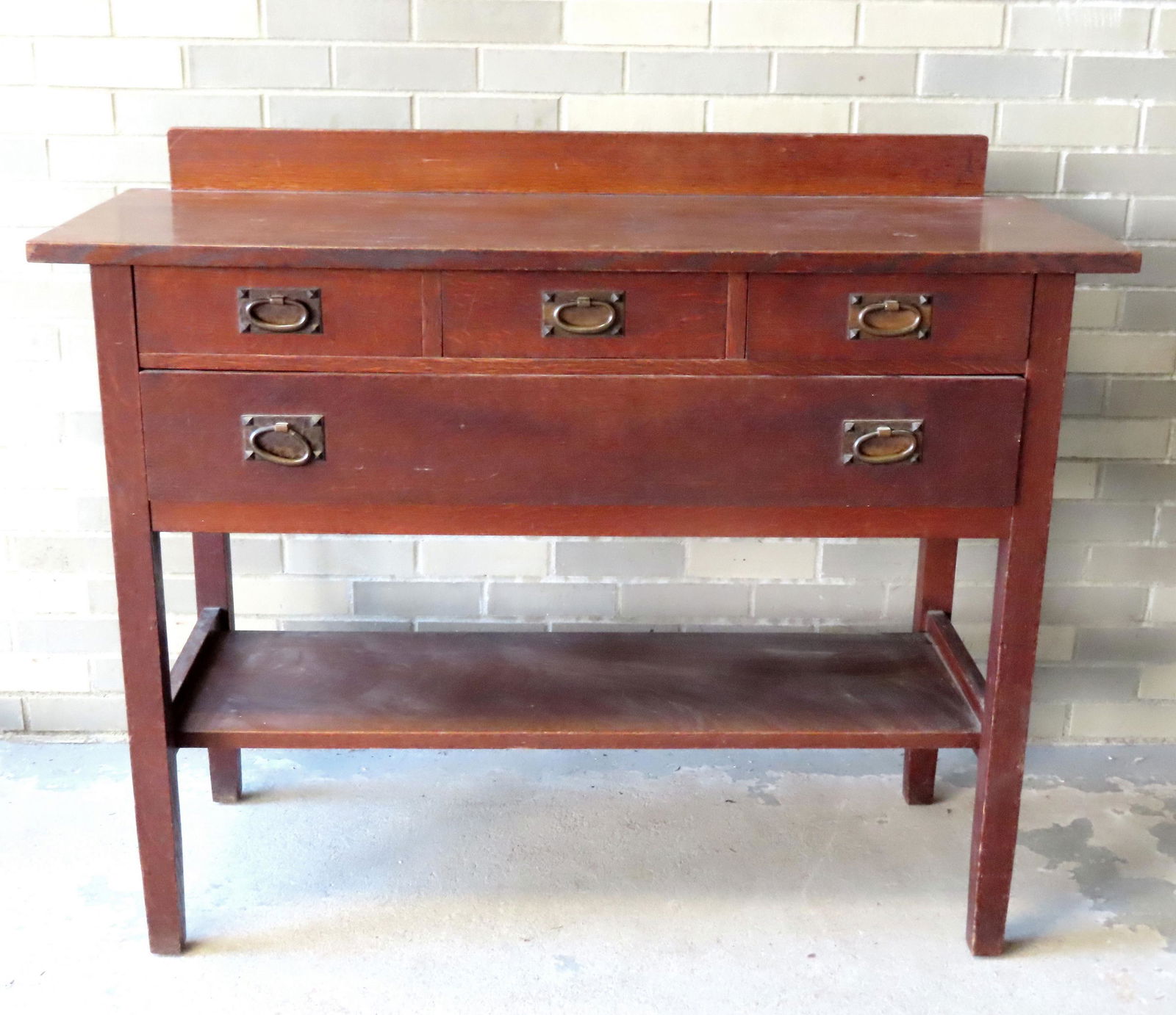 A Gustav Stickley sideboard have a short backsplash, 3 top drawers, over 1 long drawer over lower (1 of 9)