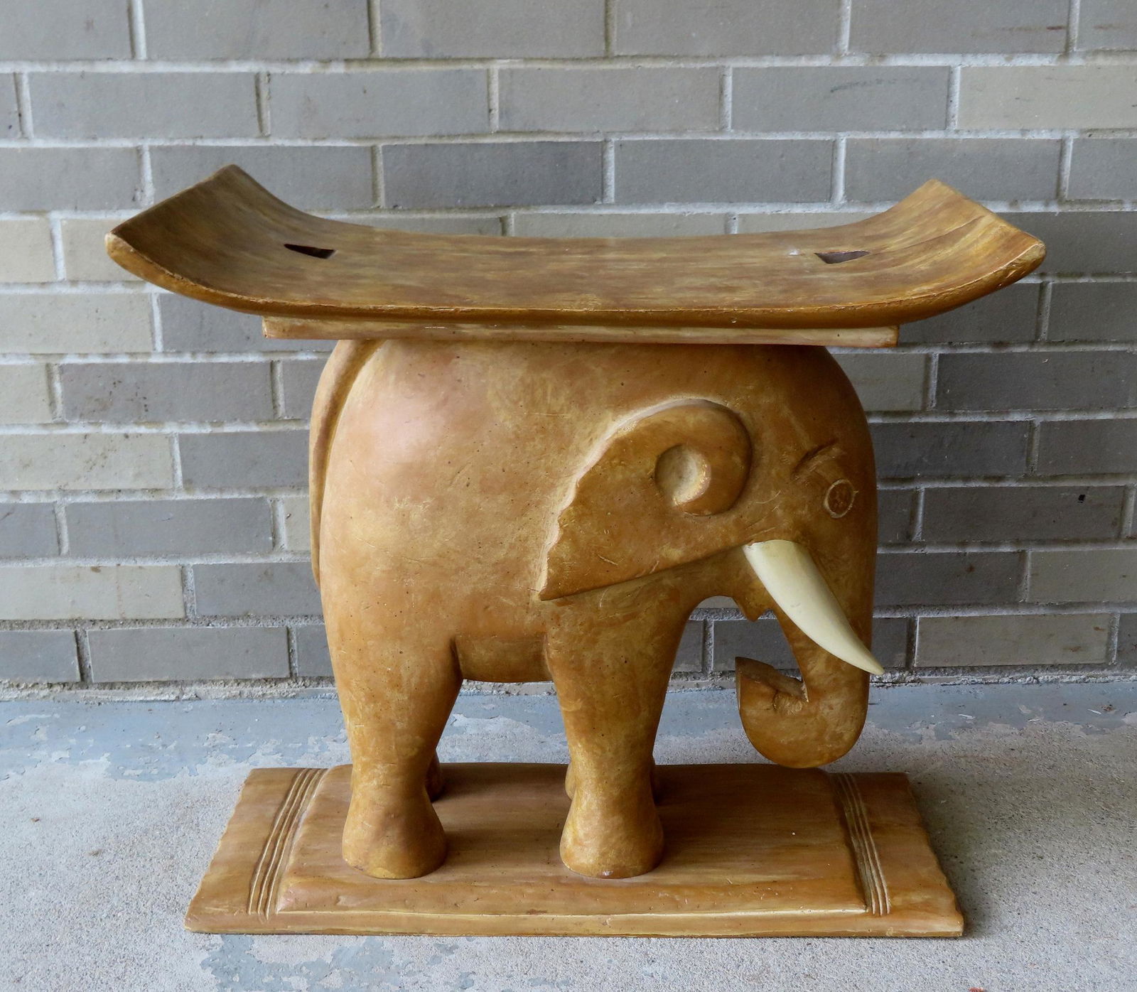 An elephant form end table signed Chapman 1976. Has the appearance of being carved wood, but likely (1 of 6)