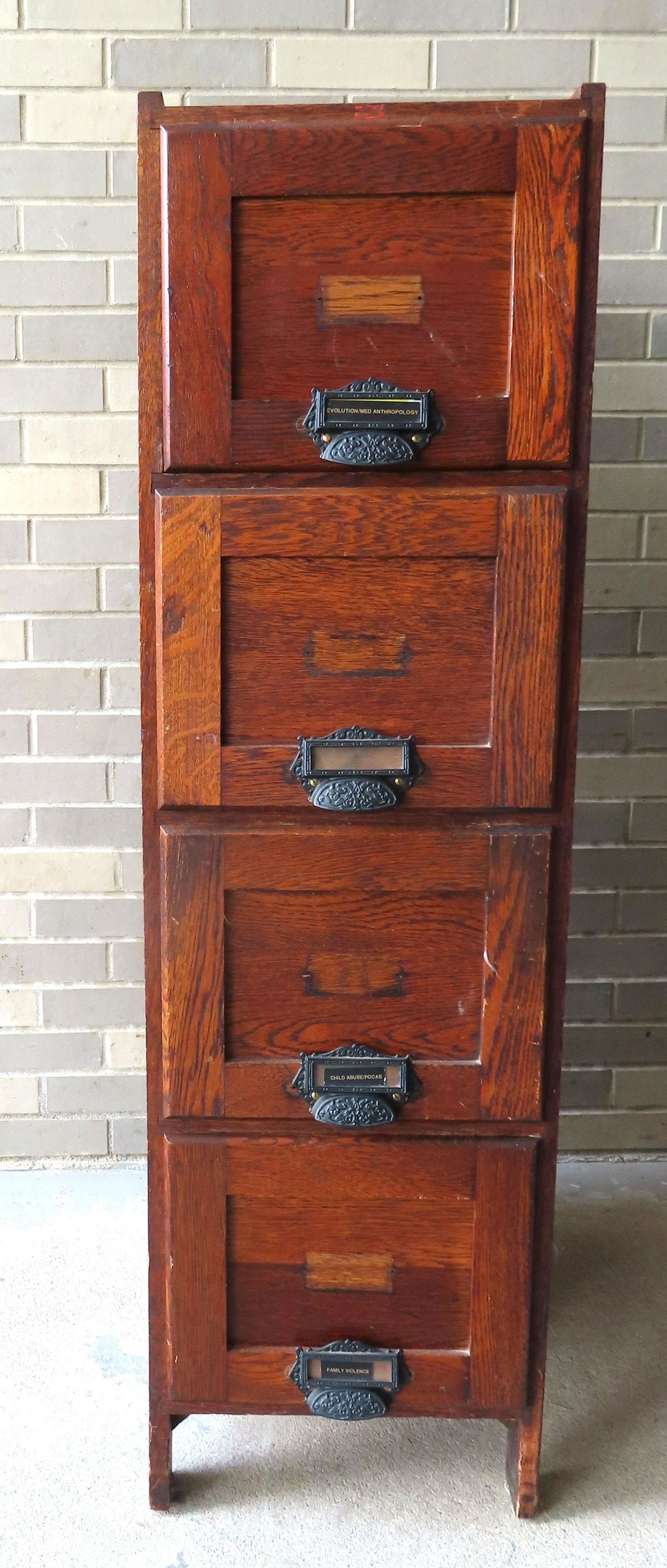 An oak 4 drawer file cabinet having metal pulls for name tags, very good condition, circa 1910-20. (1 of 5)