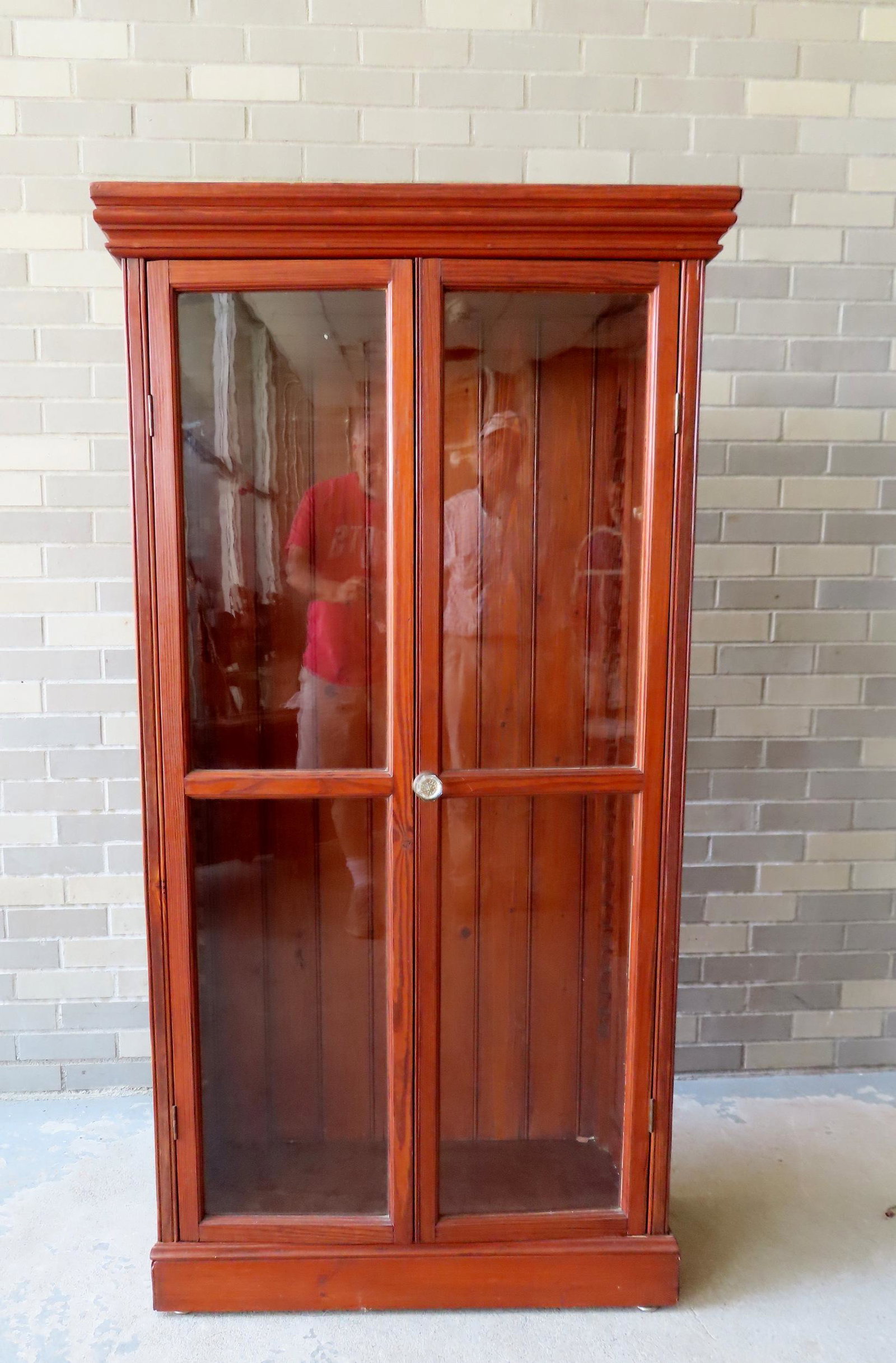 A 2 door bookcase constructed from fir wood, circa 1930. Good condition. Measures 32 1/2"W x 14"D x: A 2 door bookcase constructed from fir wood, circa 1930. Good condition. Measures 32 1/2"W x 14"D x 62"H. Provenance: From the Doris and Jerry Soldner collection, Lake Carmel NY (formally of Kingston 