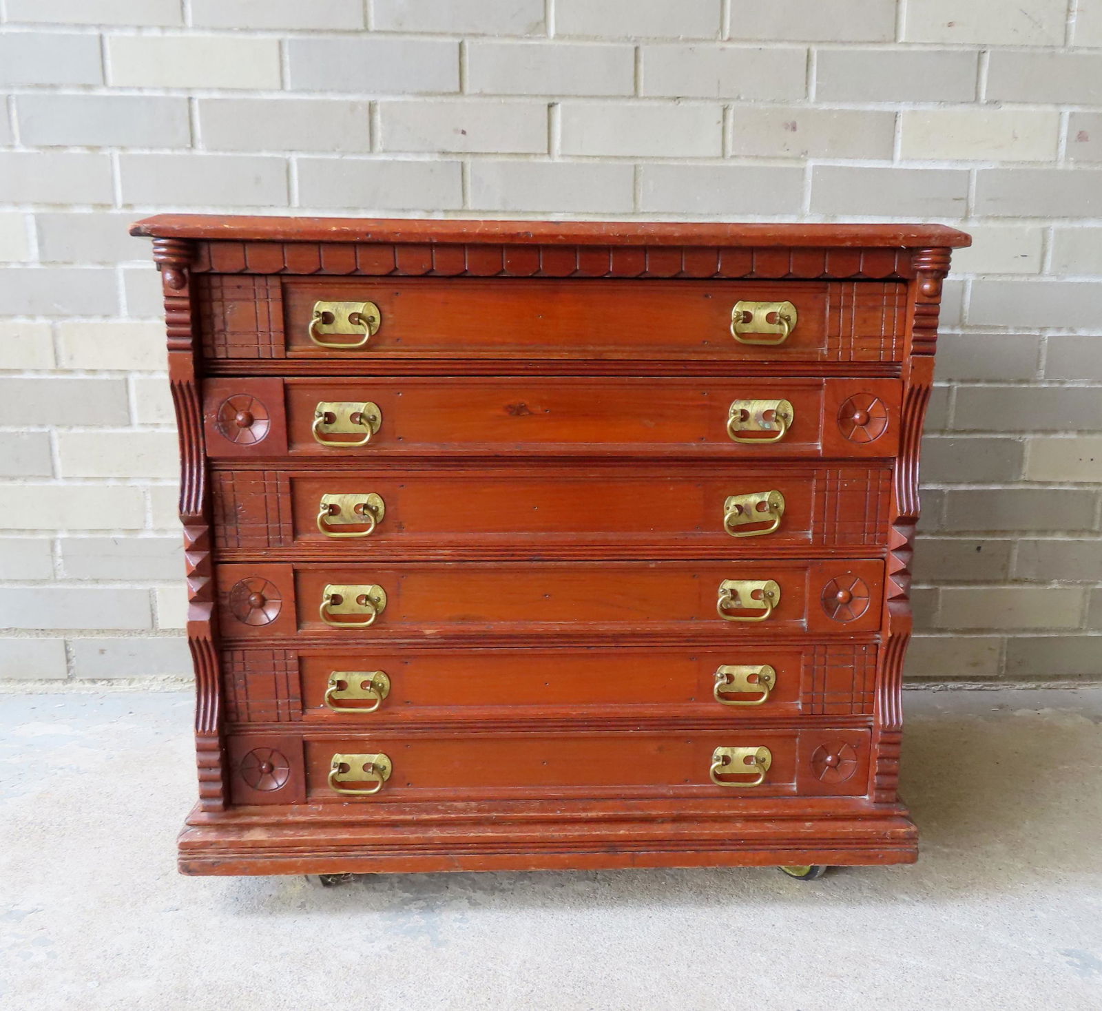 An unsigned oak 6 drawer spool cabinet mounted on newer wheels, late 19th century. Good condition. (1 of 6)