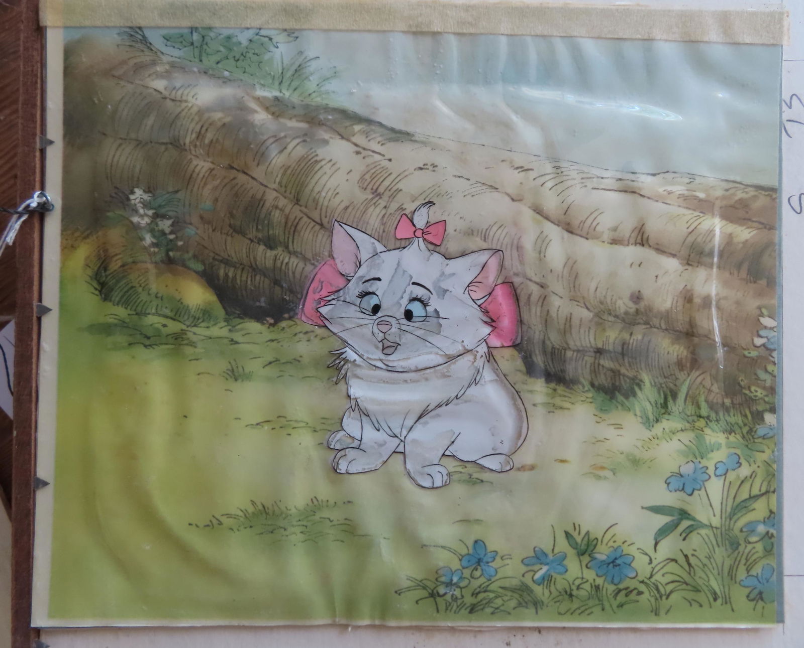 A Walt Disney hand painted animation celluloid drawing depicting a female kitten wearing pink bow, (1 of 2)