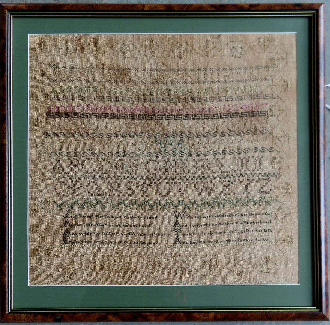An embroidered alphabet and verse sampler with vine border, illegible sewn signature bottom right (1 of 6)