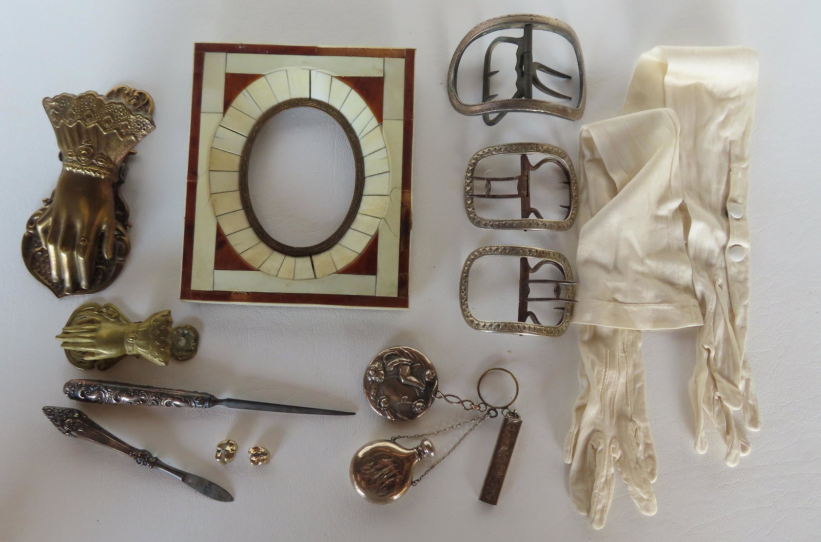 Grouping of decorative accessories including: Two gold teeth - weight 7 grams; Chatelaine with 3: Grouping of decorative accessories including: Two gold teeth - weight 7 grams; Chatelaine with 3 articles including an unmarked Art Nouveau mirror (losses to silvering), signed sterling perfume bottle