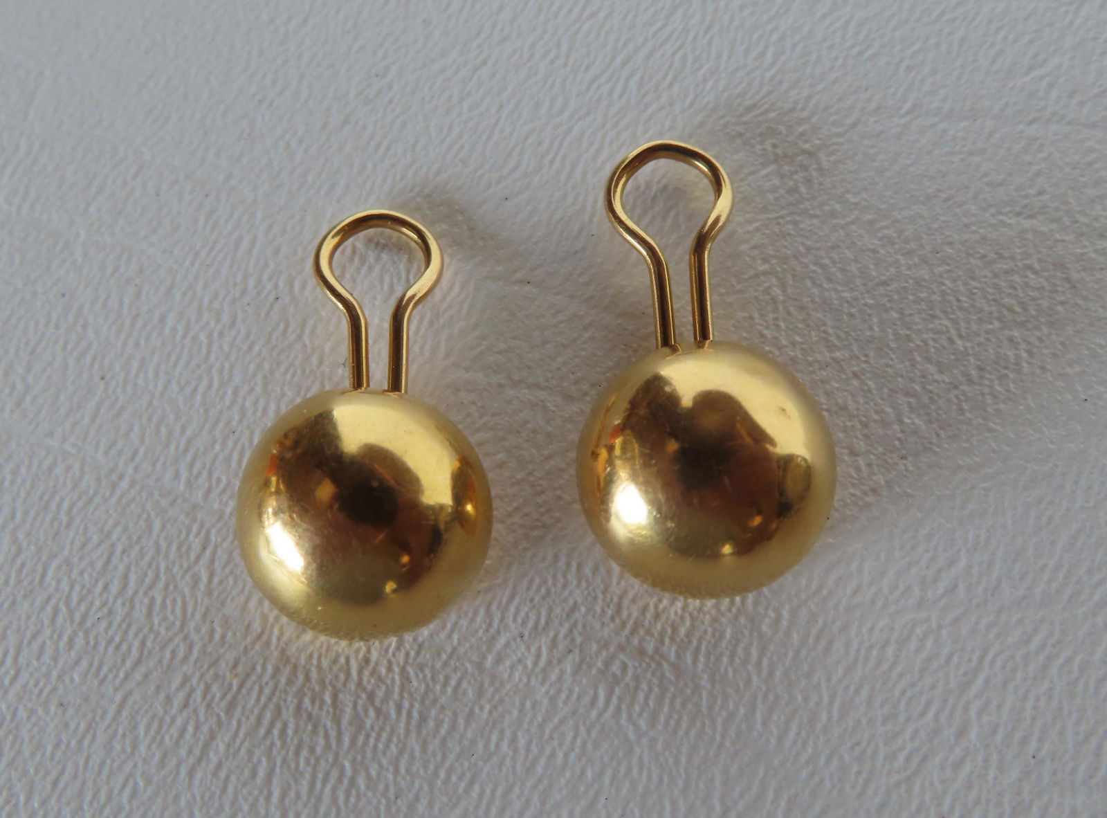 18K gold clip earrings, 6 grams - minor dings, else good condition. Provenance: From the estate of (1 of 2)